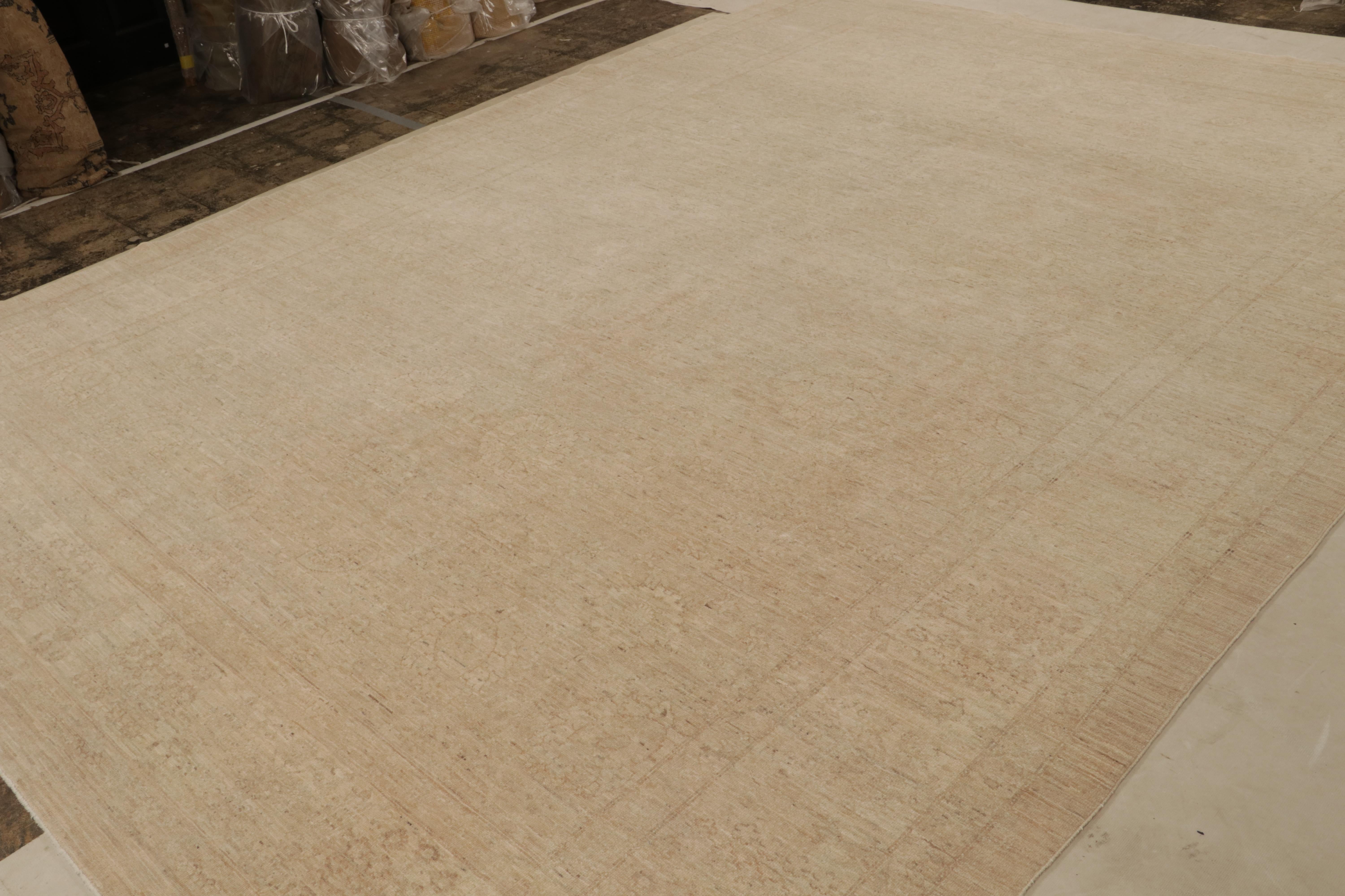 Hand-knotted in wool circa 1950-1960, this 10×14 vintage Persian Mahal rug features muted floral patterns across the surface in beige and pink tones. 

On the design: 

Featuring muted floral patterns in beige and pink accents, this antique rug is