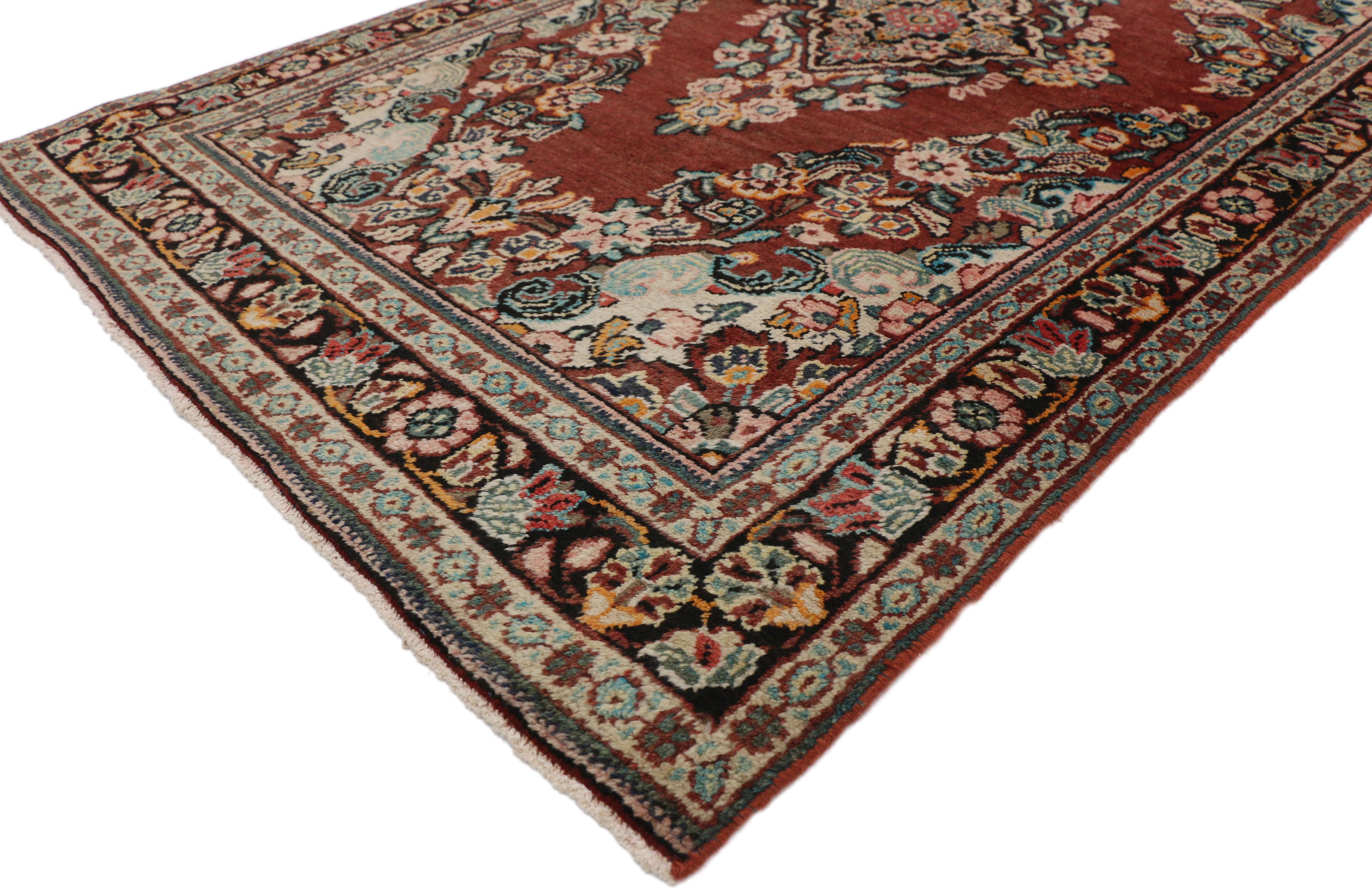 75979 vintage Persian Mahal rug with Rustic English Country style. Boasting a floral bounty in a range of warm hues, this hand knotted wool vintage Persian Mahal rug is a delightful example of rustic English Country style. At the center of the