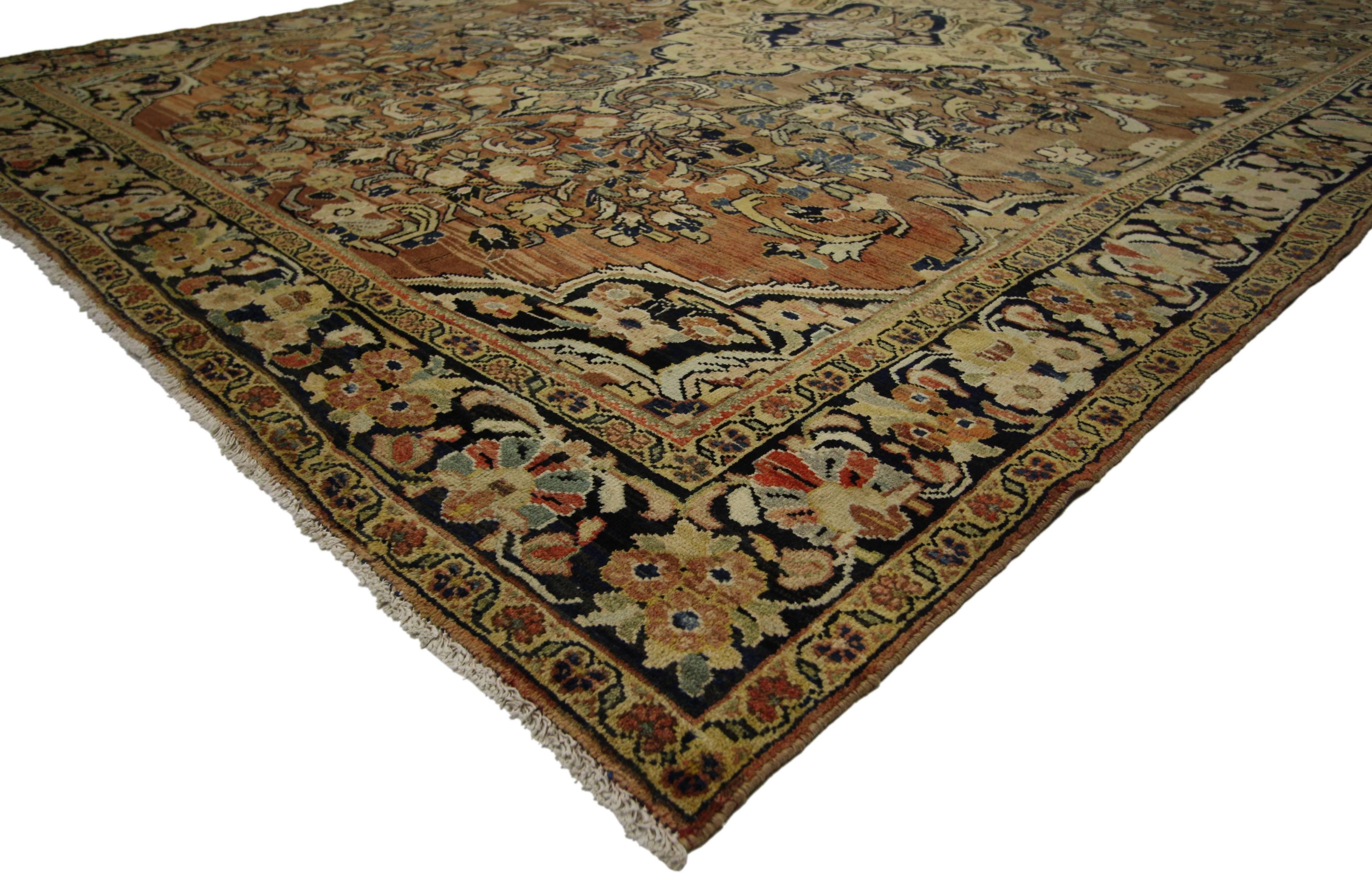 76321 Vintage Persian Mahal Rug with Warm Colors and Victorian Style 07'09 X 10'07. This hand knotted wool vintage Persian Mahal rug features a cusped centre medallion surrounded by an all-over floral pattern composed of blooming palmettes, curled
