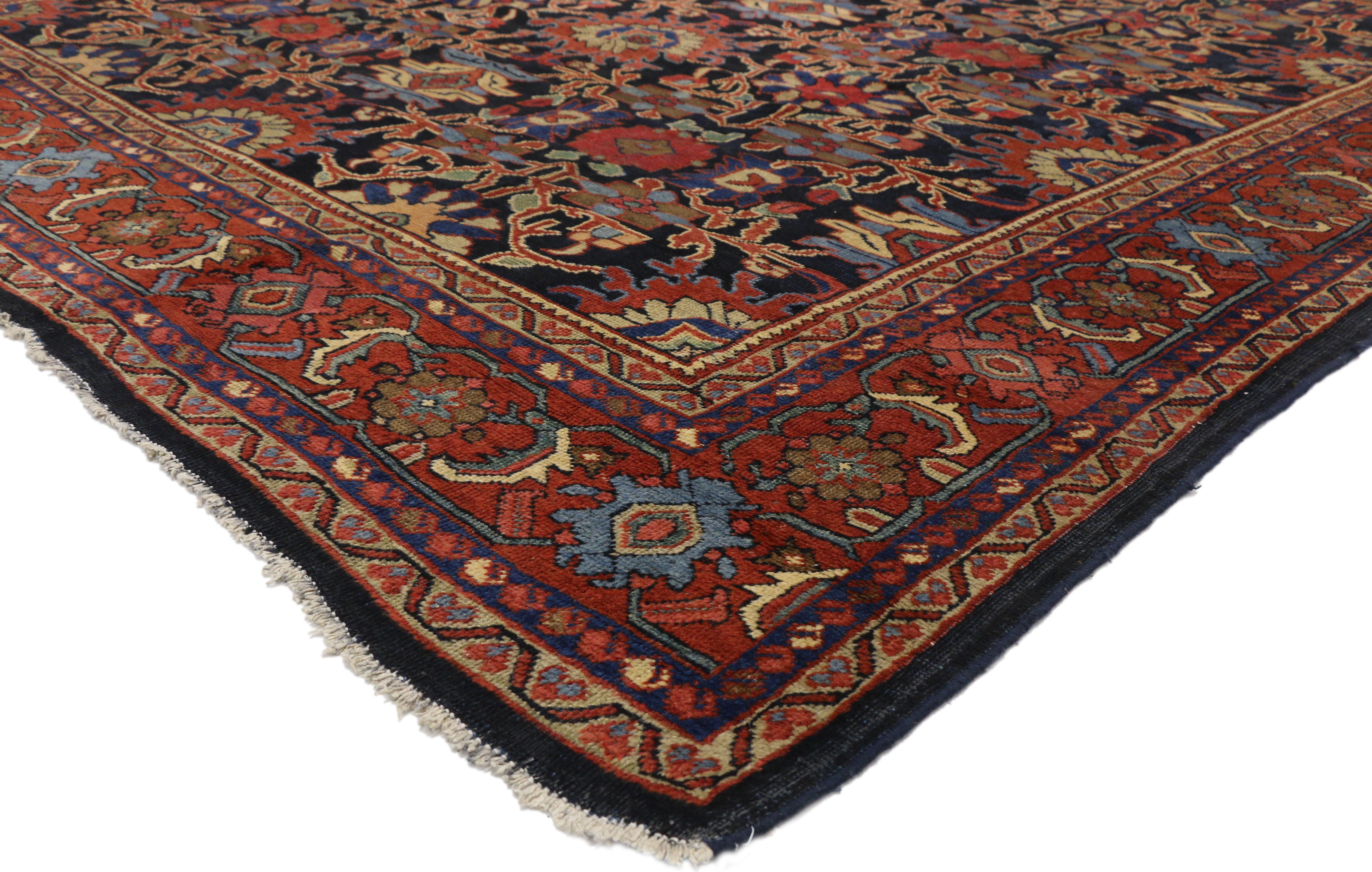 72546  Distressed Antique Persian Mahal Rug with Rustic English Traditional Style 08'08 X 12'00. This hand-knotted wool antique Persian Mahal rug beautifully embodies a modern rustic English traditional style. The dark navy blue field is covered in