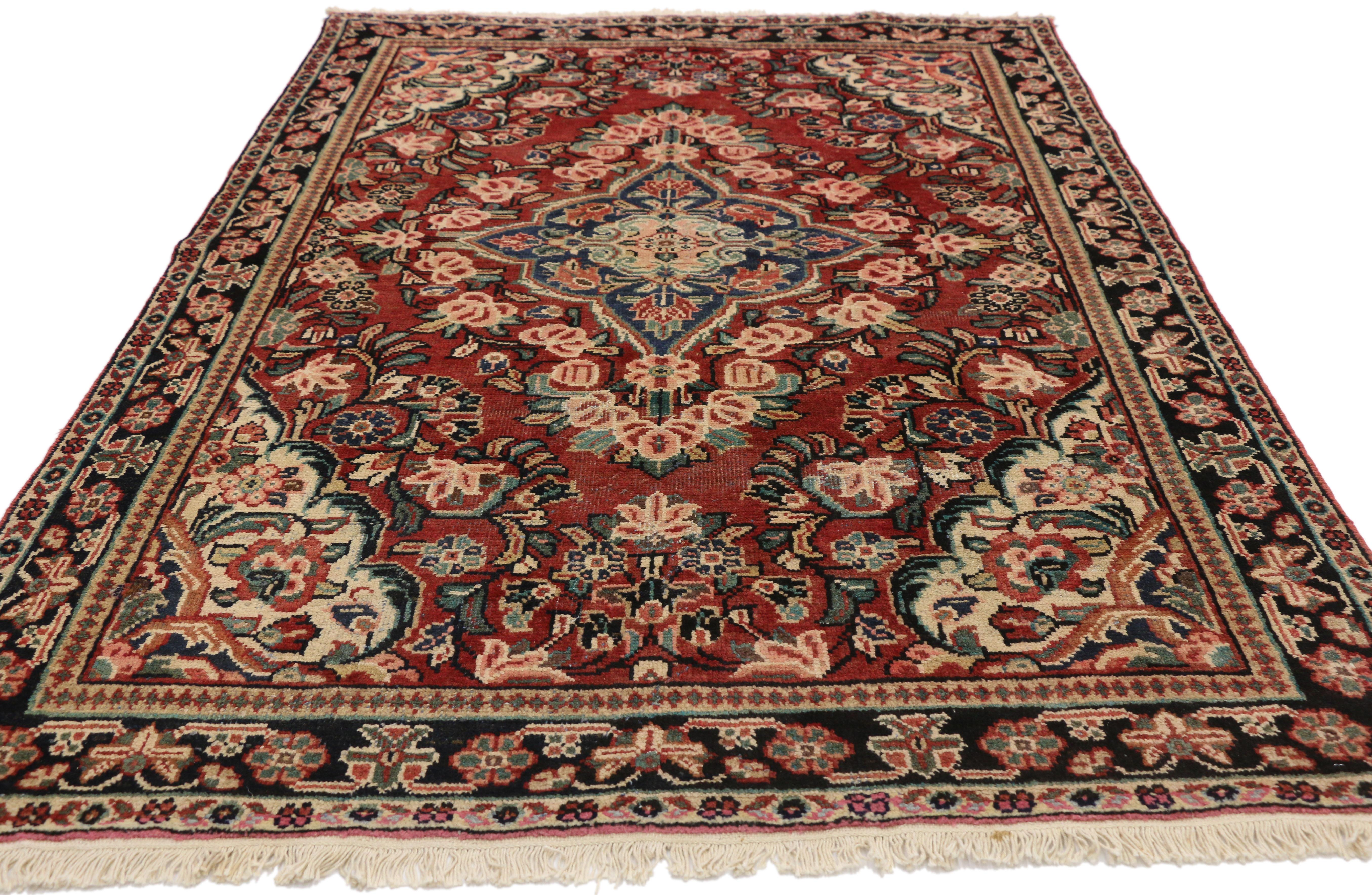 75675 Vintage Persian Mahal Sarouk Rug with Rustic English Country Style, Entry Rug 04'03 x 06'07. Boasting a floral bounty in a range of warm hues, this hand knotted wool vintage Persian Mahal Sarouk rug is a delightful example of rustic English