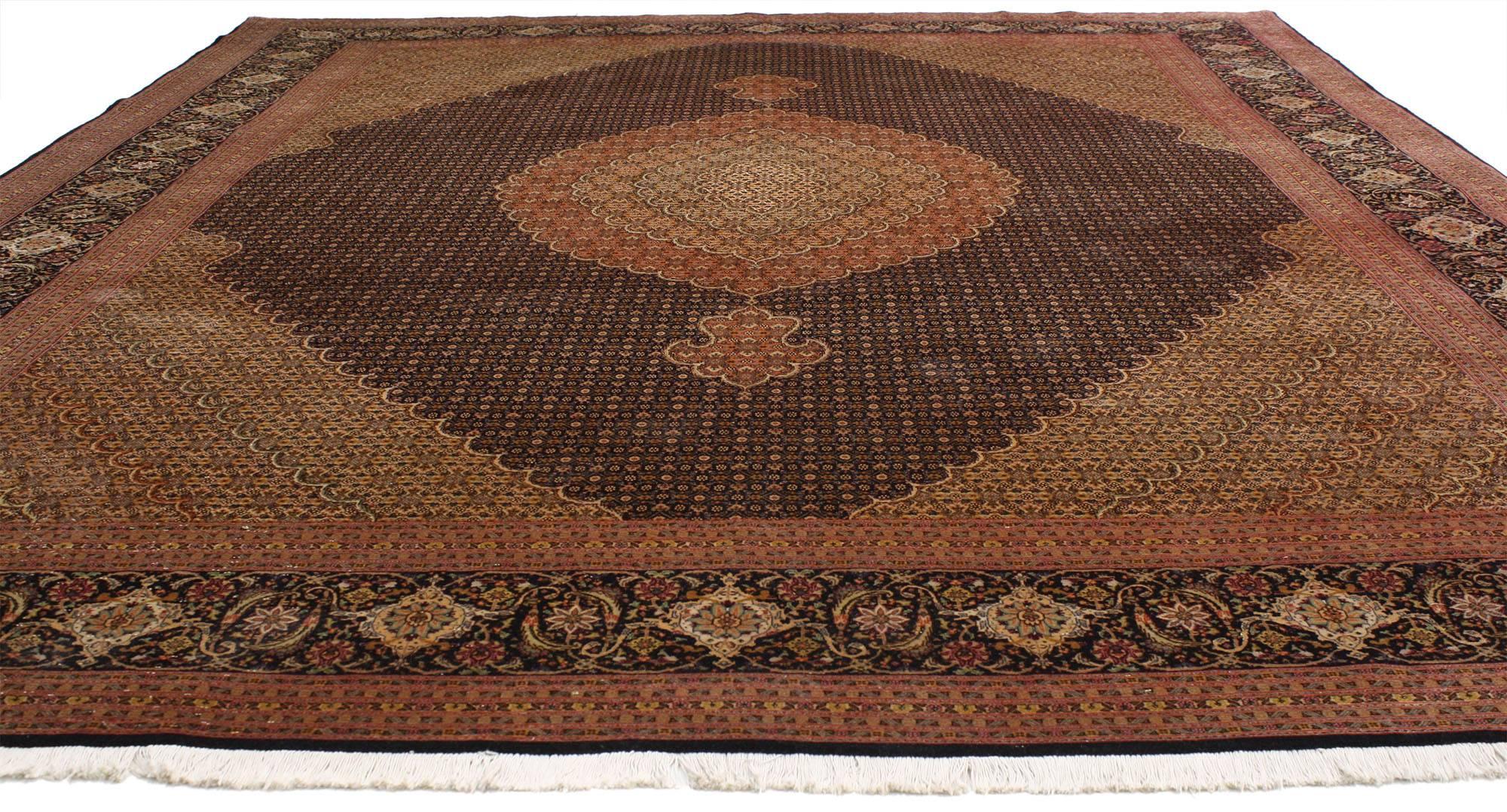 76980, vintage Persian Mahi fish design Tabriz rug with traditional style. This eye-catching beauty of a vintage Persian Tabriz rug features a central overlapping floral medallion. The medallion floats in a sea of delicate flowers captivating the