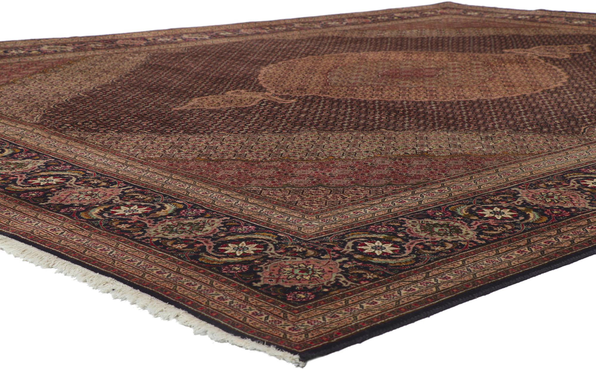 61005 Vintage Persian Mahi Tabriz rug, 09'11 x 12'08. With ornate details and well-balanced symmetry, this hand-knotted wool vintage Persian Mahi Tabriz rug is poised to impress. Taking center stage is a a cusped medallion anchored with palmette