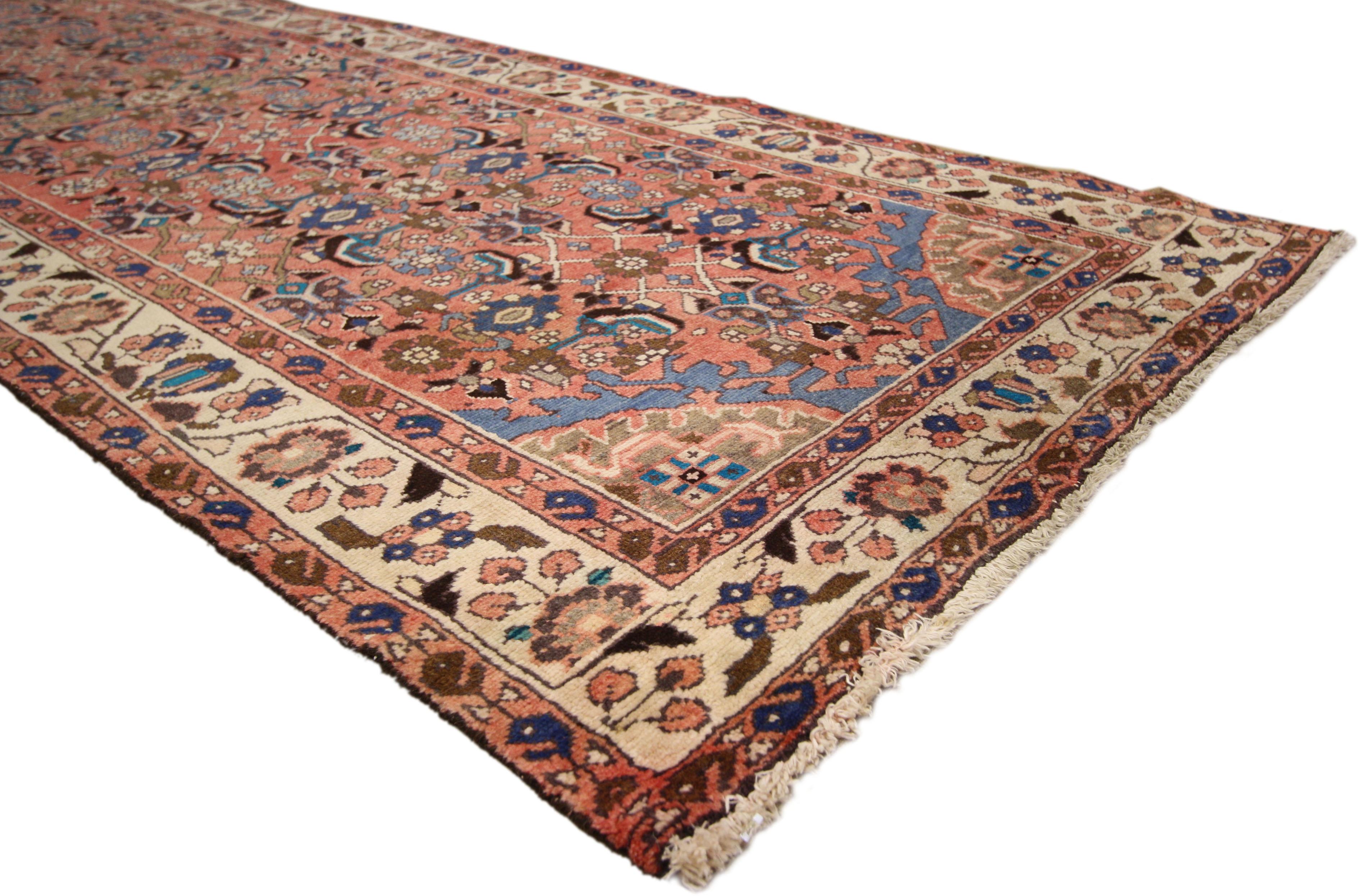 74306, vintage Persian Malayer runner, hallway runner. This hand-knotted wool vintage Persian Malayer runner features a lively all-over Herati pattern on an abrashed field. The richness and variety of motifs employed give the carpet runner’s central