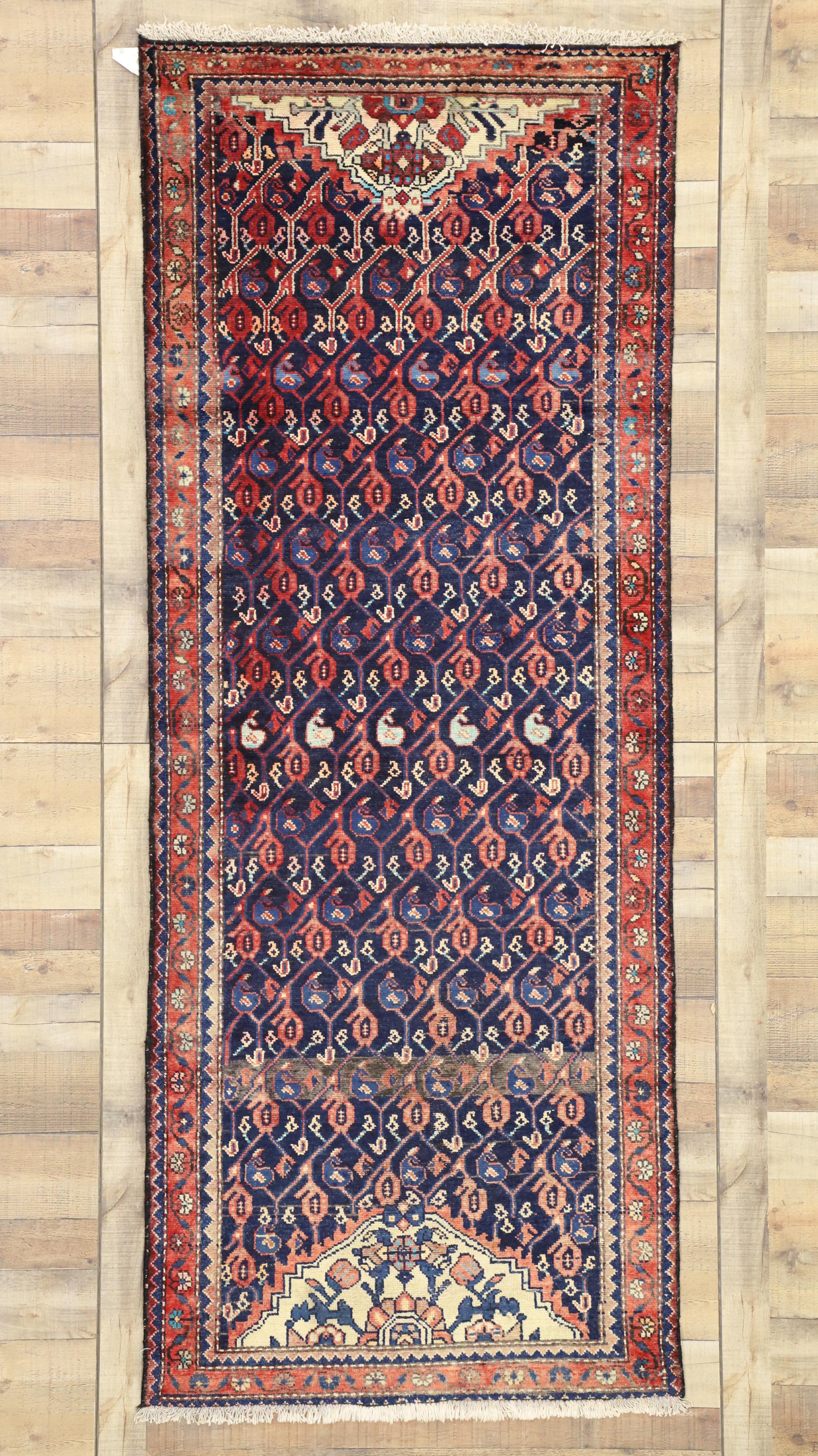 75212 vintage Malayer rug runner. This exquisite example of a Persian Malayer runner features a repeating all-over boteh pattern in variegated shades of blue and red bordered with a replicated meandering flower and vine motif. Featuring a refined