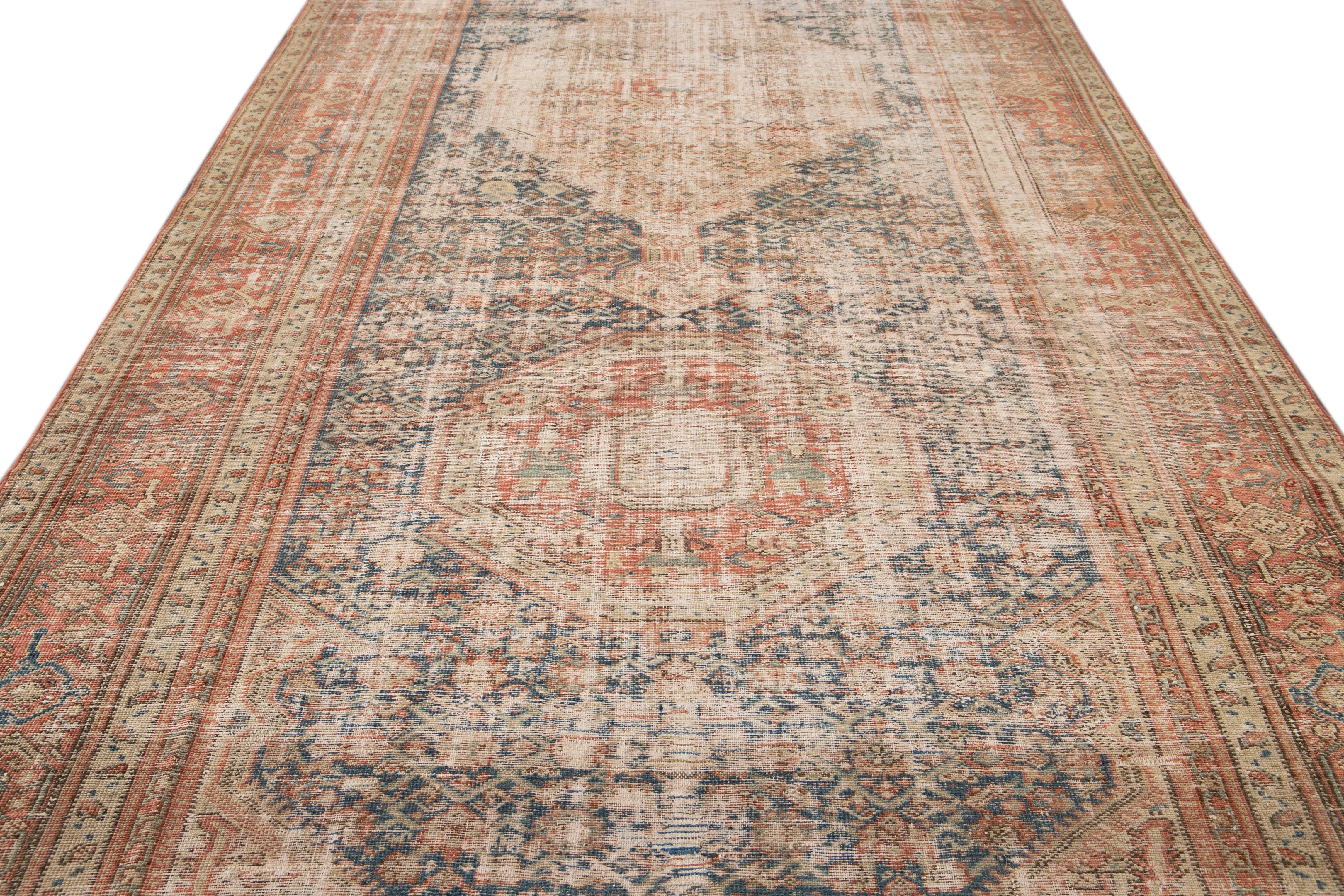 Beautiful vintage Persian Malayer hand knotted runner with a blue field, beige, and red accents in an all-over geometric motif design.

This rug measures: 7'3
