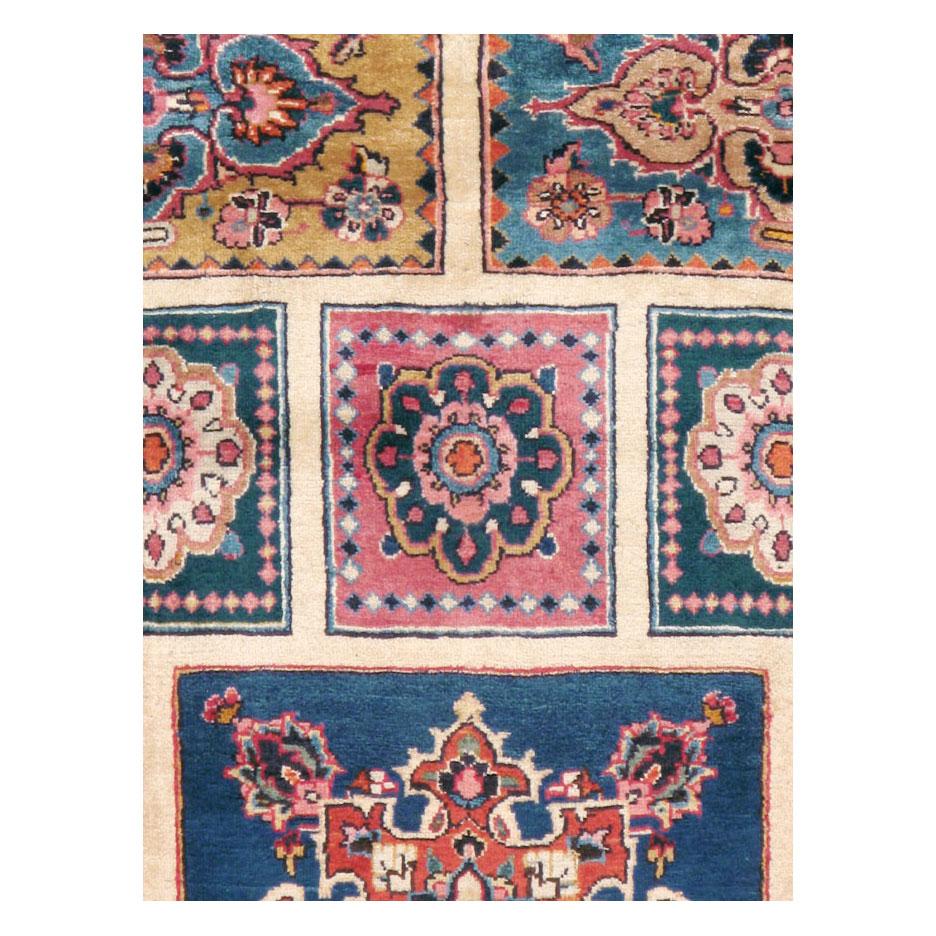 A vintage Persian Mashad accent rug handmade during the mid-20th century.

Measures: 6' 4