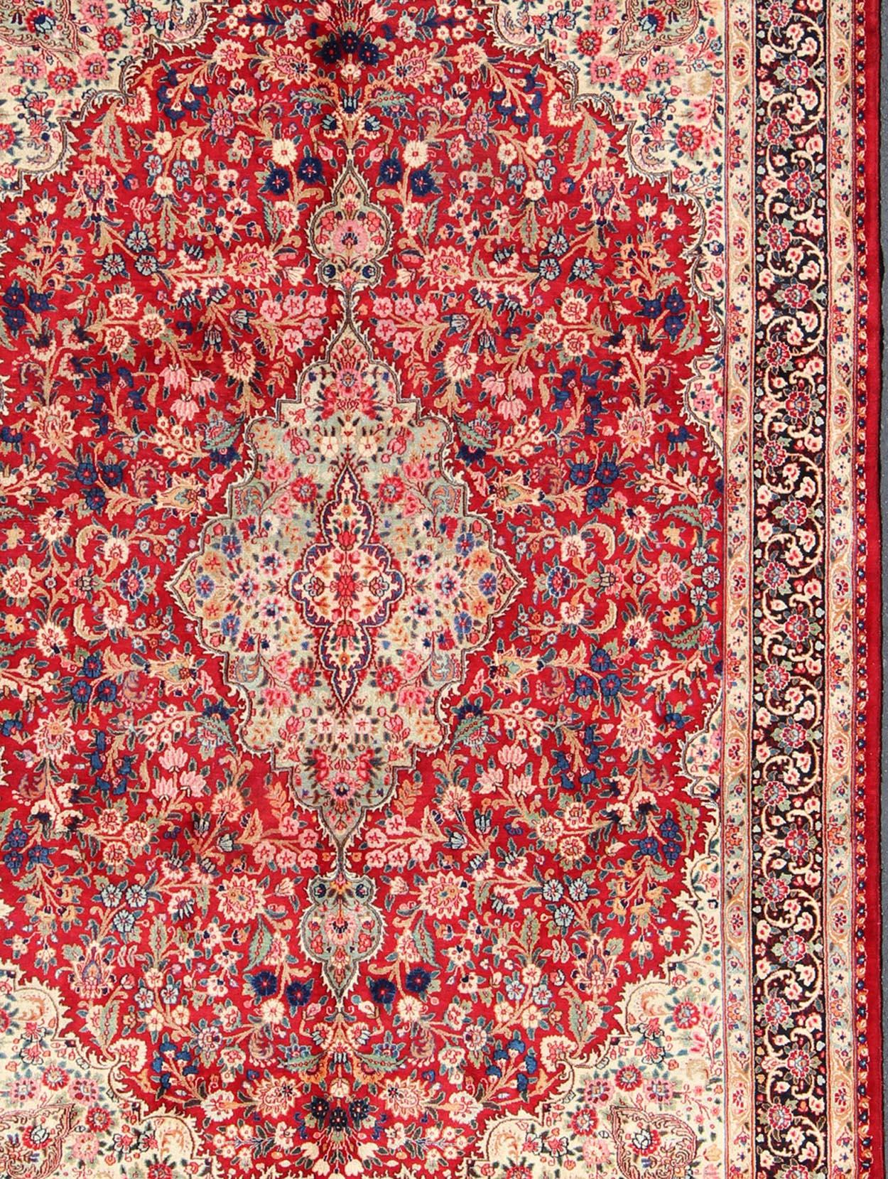 Vintage Persian Mashad rug with ornate floral medallion design in red, cream, and onyx, rug h-401-9, country of origin / type: Iran / Mashad, circa 1950

This highly decorative and elaborate vintage Persian Mashad carpet features a multi-tiered
