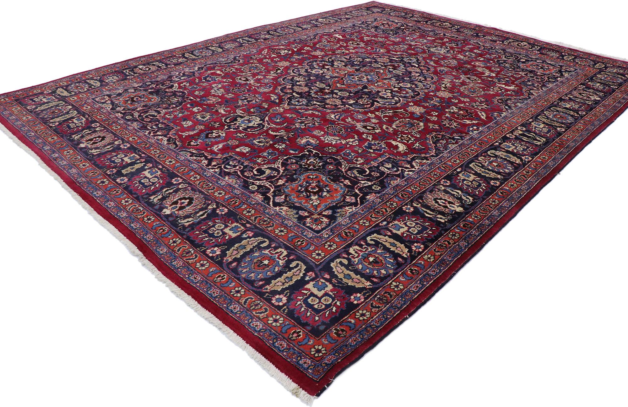 75669, vintage Persian Mashhad Area rug with traditional Victorian style. This hand knotted wool vintage Persian Mashhad rug features a cusped lozenge 16-point Mashhad medallion flanked by palmette finials at each end floating among bouquets of