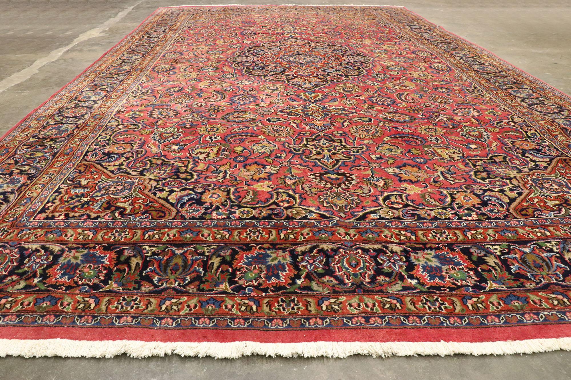 Hand-Knotted Vintage Persian Mashhad Rug, Regal Charm Meets Timeless Elegance For Sale