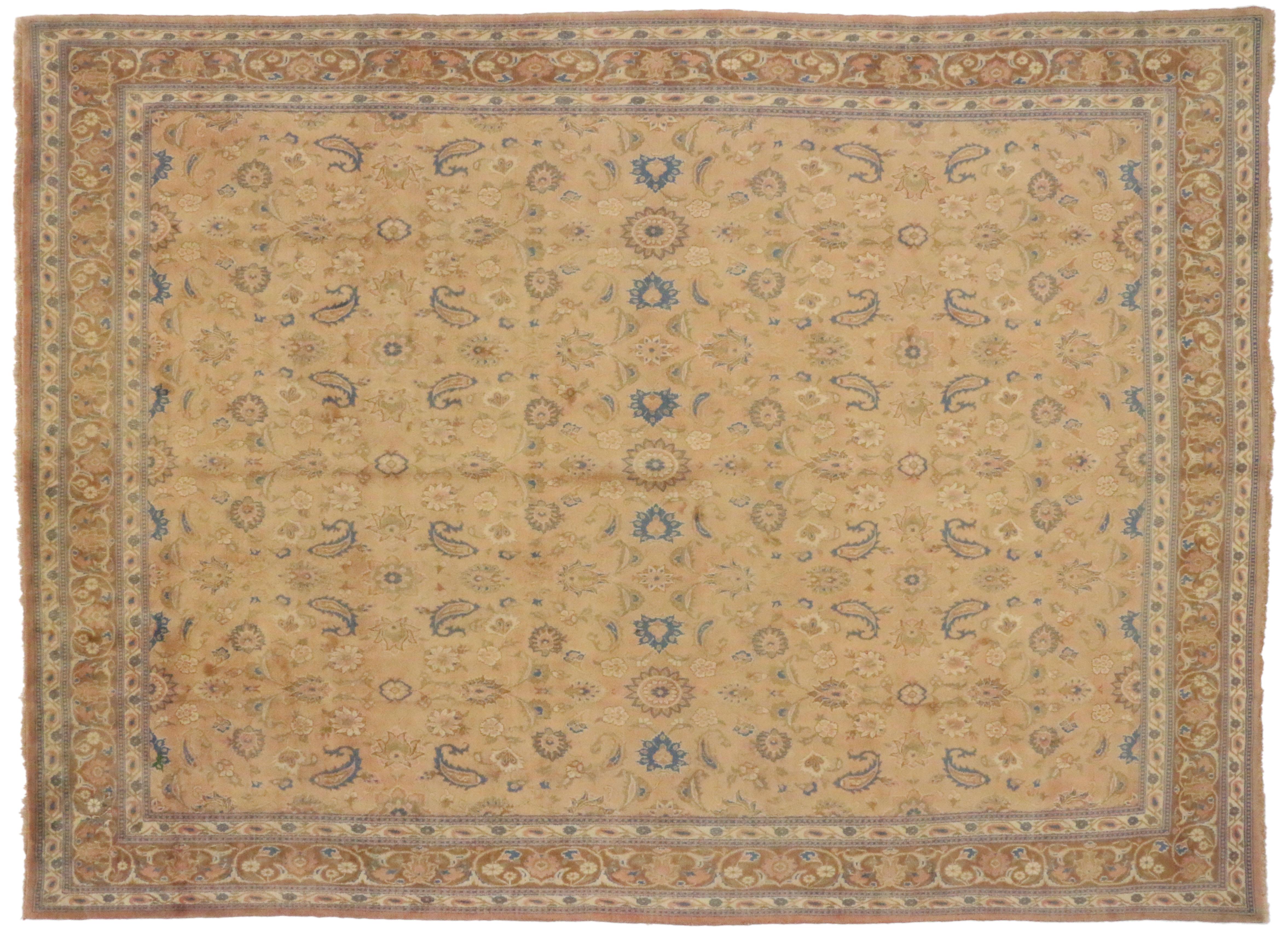 75530 Vintage Persian Mashhad Area Rug with Rustic Georgian Style. This hand-knotted wool vintage Persian Mashhad area rug features an all-over floral pattern composed of palmettes and botehs spread across an abrashed rust colored field. It is
