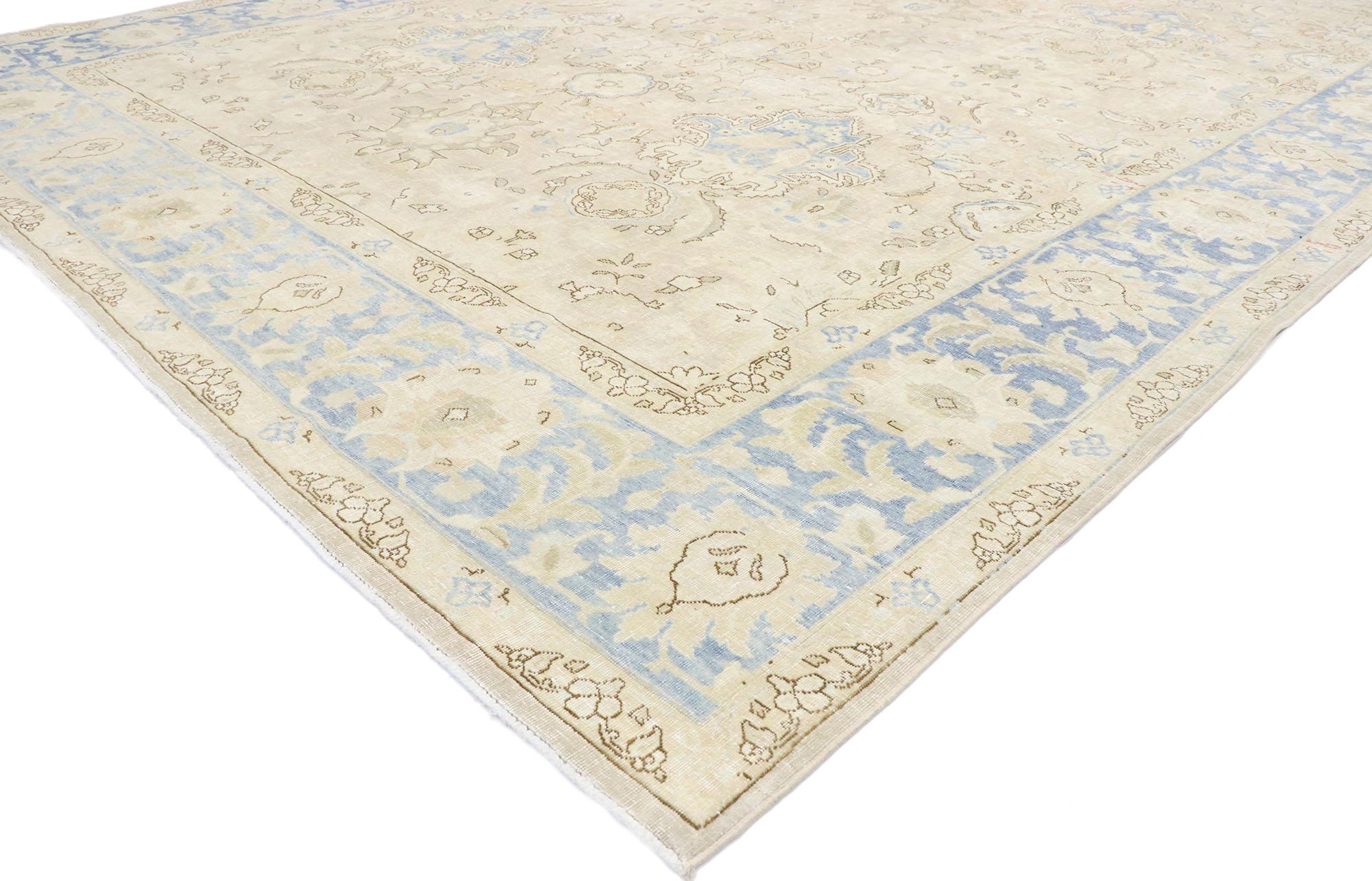 53465, vintage Persian Mashhad rug with transitional coastal style. Light and airy with coastal vibes, this hand-knotted wool vintage Persian Mashhad rug is poised to impress. The antique washed field features an all-over botanical pattern comprised