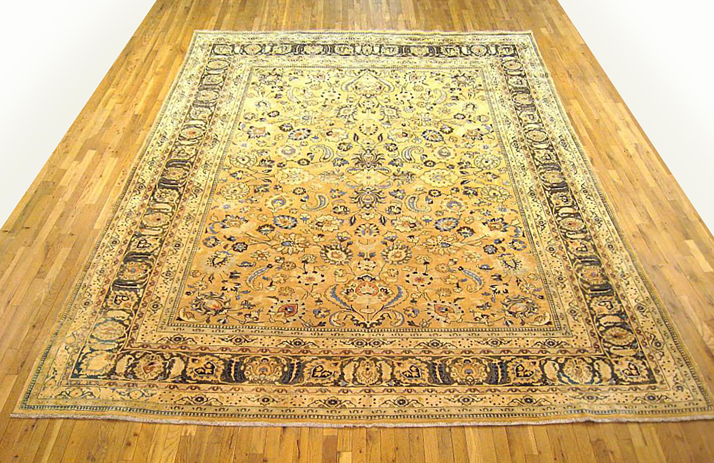 Antique Persian Meshed Oriental rug, Room size

An antique Persian Meshed oriental rug, size 13'0 x 10'0, circa 1920. This handsome hand-woven geometric rug features floral elements allover the beige field. The central field is enclosed within an