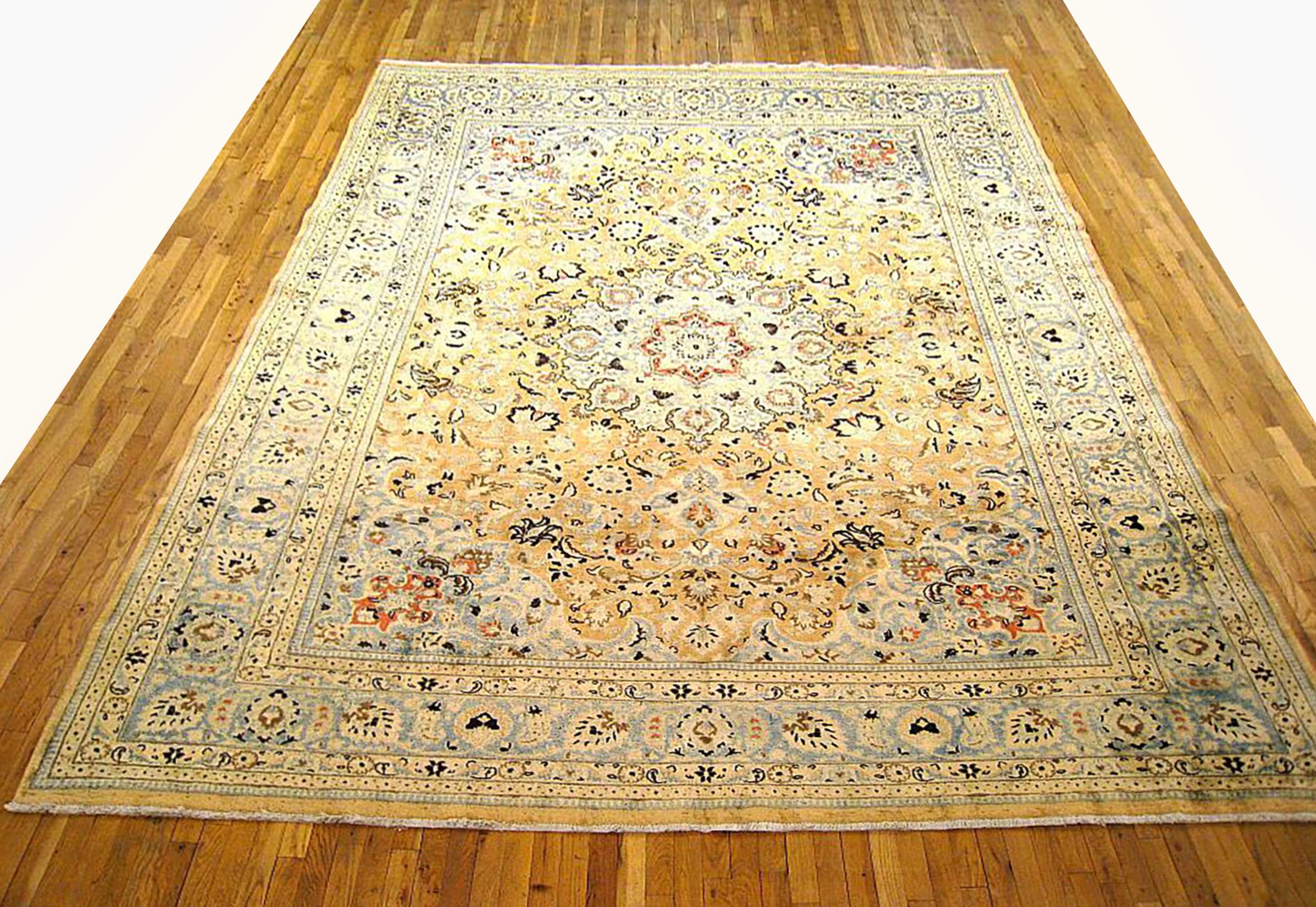 Antique Persian Meshed Oriental Rug, Room size

An antique Persian Meshed oriental rug, size 12'8 x 10'2, circa 1920.  This handsome hand-woven geometric rug features floral elements allover the ivory field.  The central field is enclosed within an