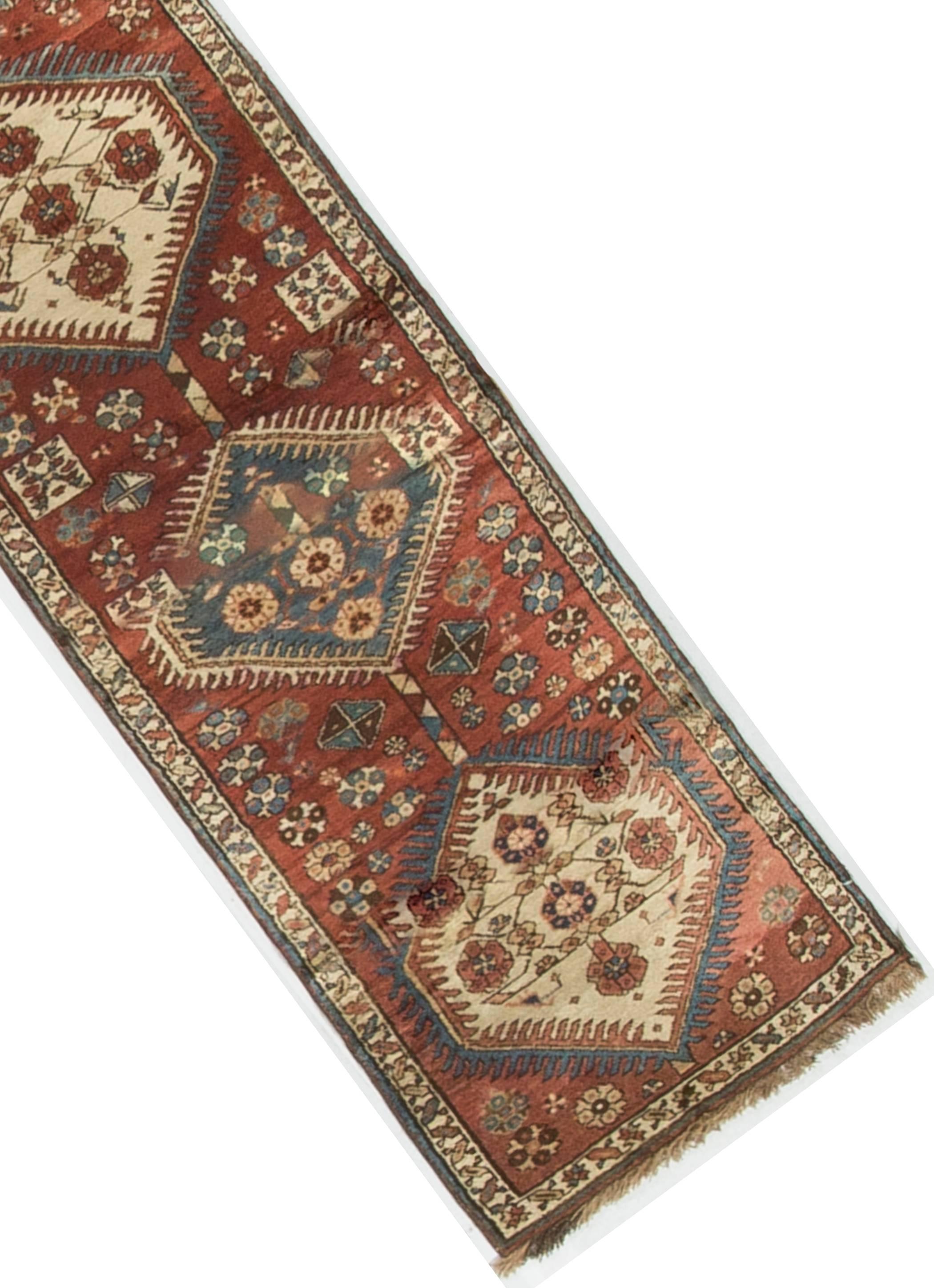 A vintage handwoven Persian Meshkin rug. Meshkin is in the northwest Azerbaijan area of Persia. Although not one of the more familiar areas of rug production their rugs have wonderful designs and are of a high quality.