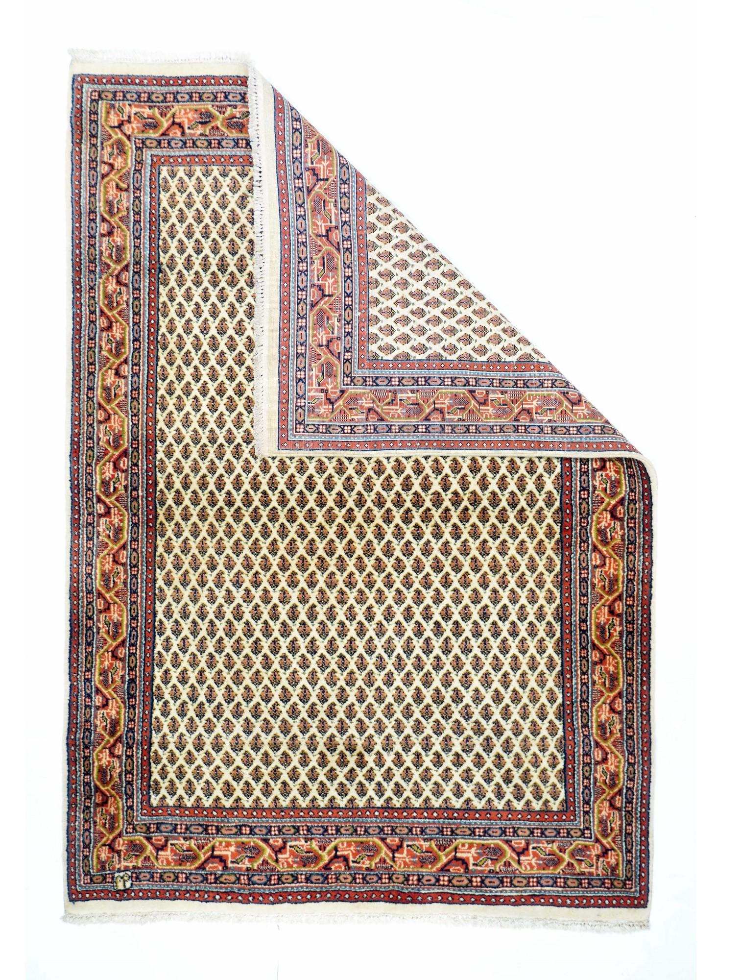 Vintage Persian Mir Rug 3'10'' x 5'10''. The cream field of this well-woven interpretation of the classic Saraband design, shows literally hundreds of row reversing small floriated botehs set in an offset, half-drop layout. Angular 