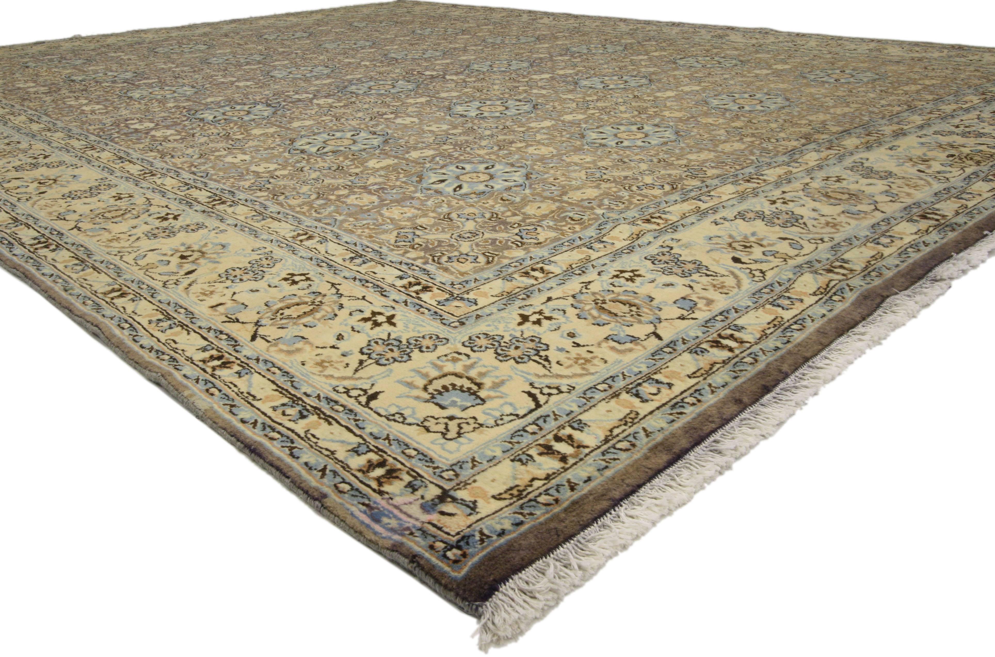 Hand-knotted wool vintage Persian Moud Mood rug features an all-over design representing the Four Seasons surrounded by a complementary border. Rendered in variegated shades of brown, lavender-gray, taupe, light blue, charcoal, tan, beige and cream.
