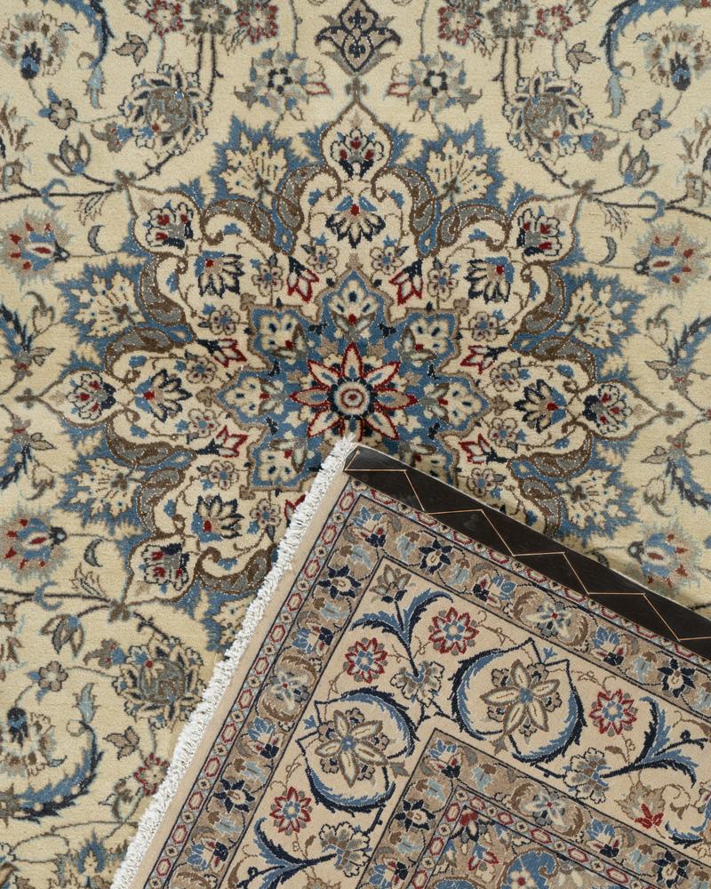 5'3 x 8'11. Finely woven in a combination of wool & silk with intricately ultra fine patterns to create a classically beautiful rug. The soft coloring allows you to enjoy details without overbearing the room. Colors: ivory, navy, soft blue.