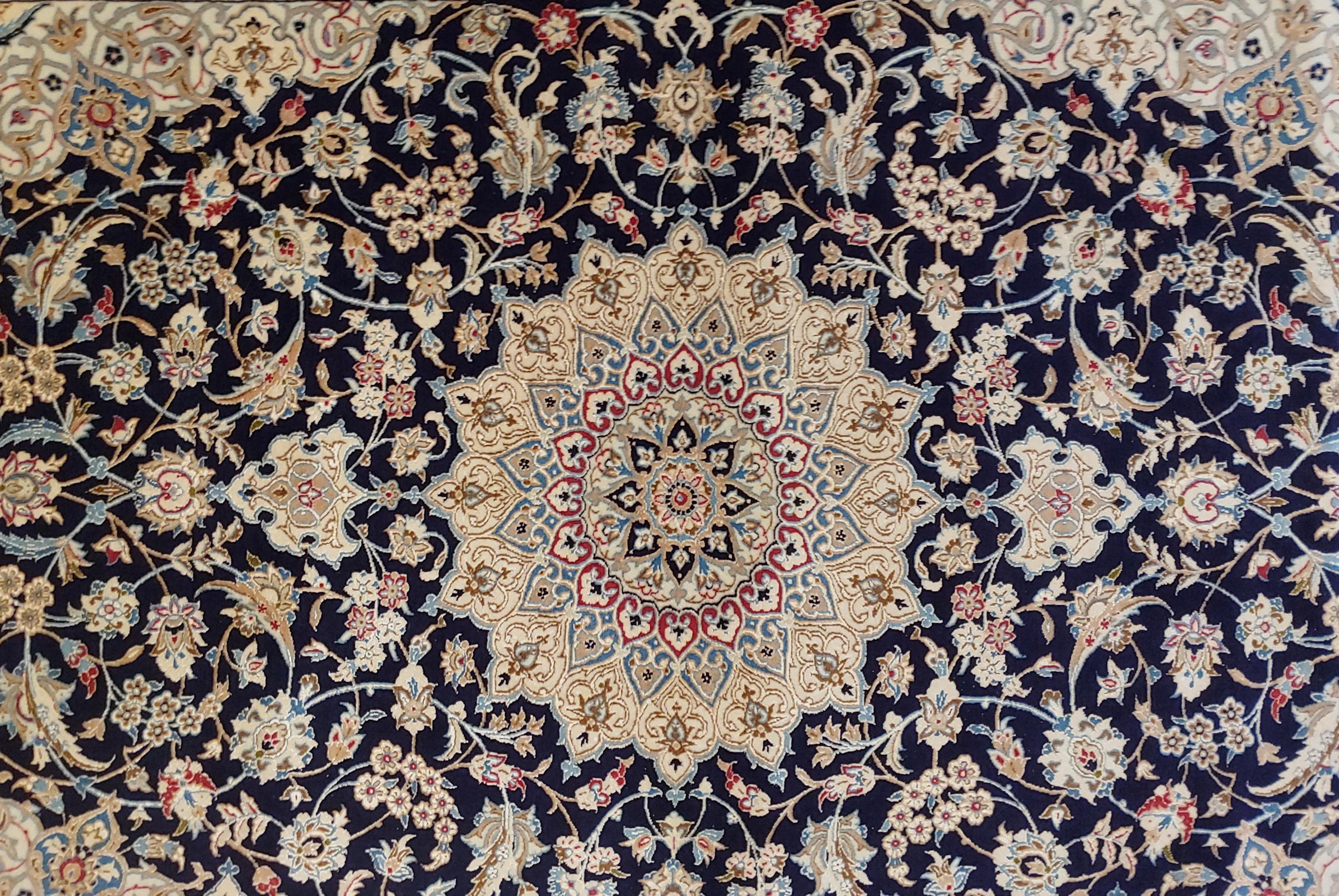 Extraordinary and very fine Persian Nain rug. It is a wool pile with silk highlights woven on linen. It uses the traditional Nain colors of blues and taupe with a medallion design, circa 1970. Measures: 4 x 6-4.