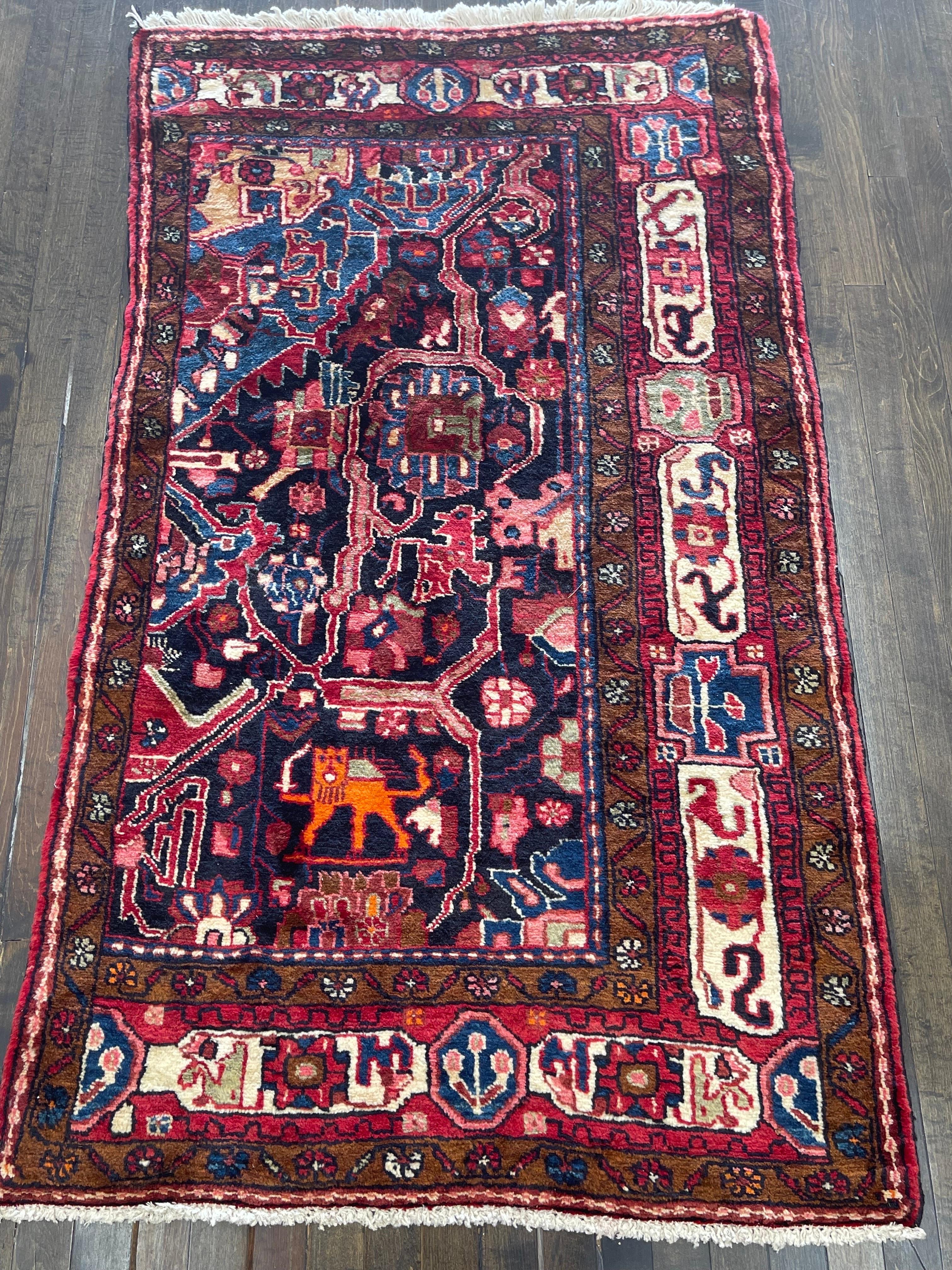 A cute sampler rug on a dark blue field and sky blue corner which was made to showcase how a larger rug might look like.

 Sampers like this provide a means by which designs may be passed from one weaver to another or from one generation to the
