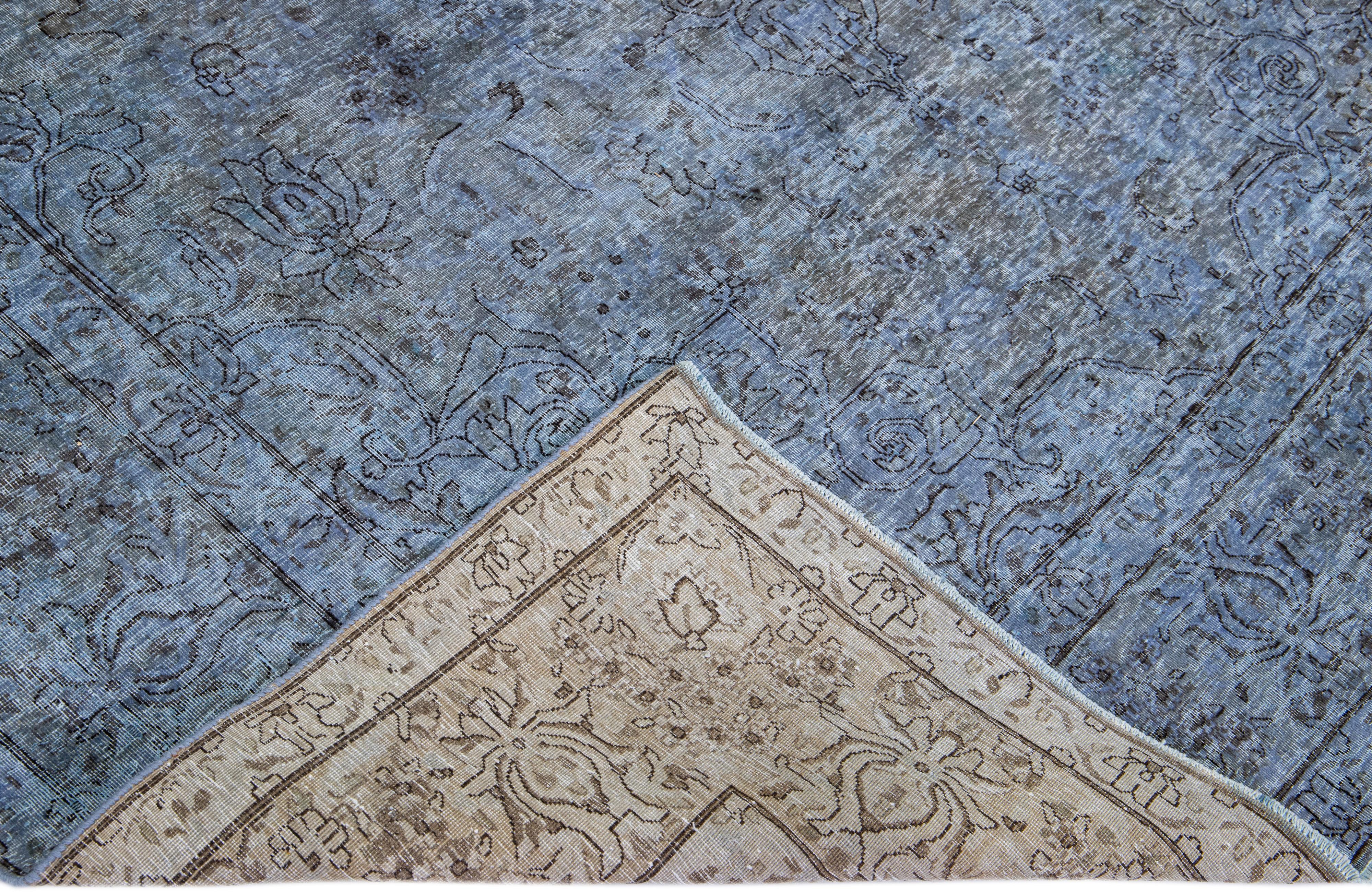 Beautiful Vintage Overdyed hand-knotted wool rug with a blue field. This Persian rug has an all-over design.

This rug measures: 7'' x 9'2