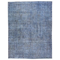 Tappeto persiano vintage in lana blu sovratinto a mano