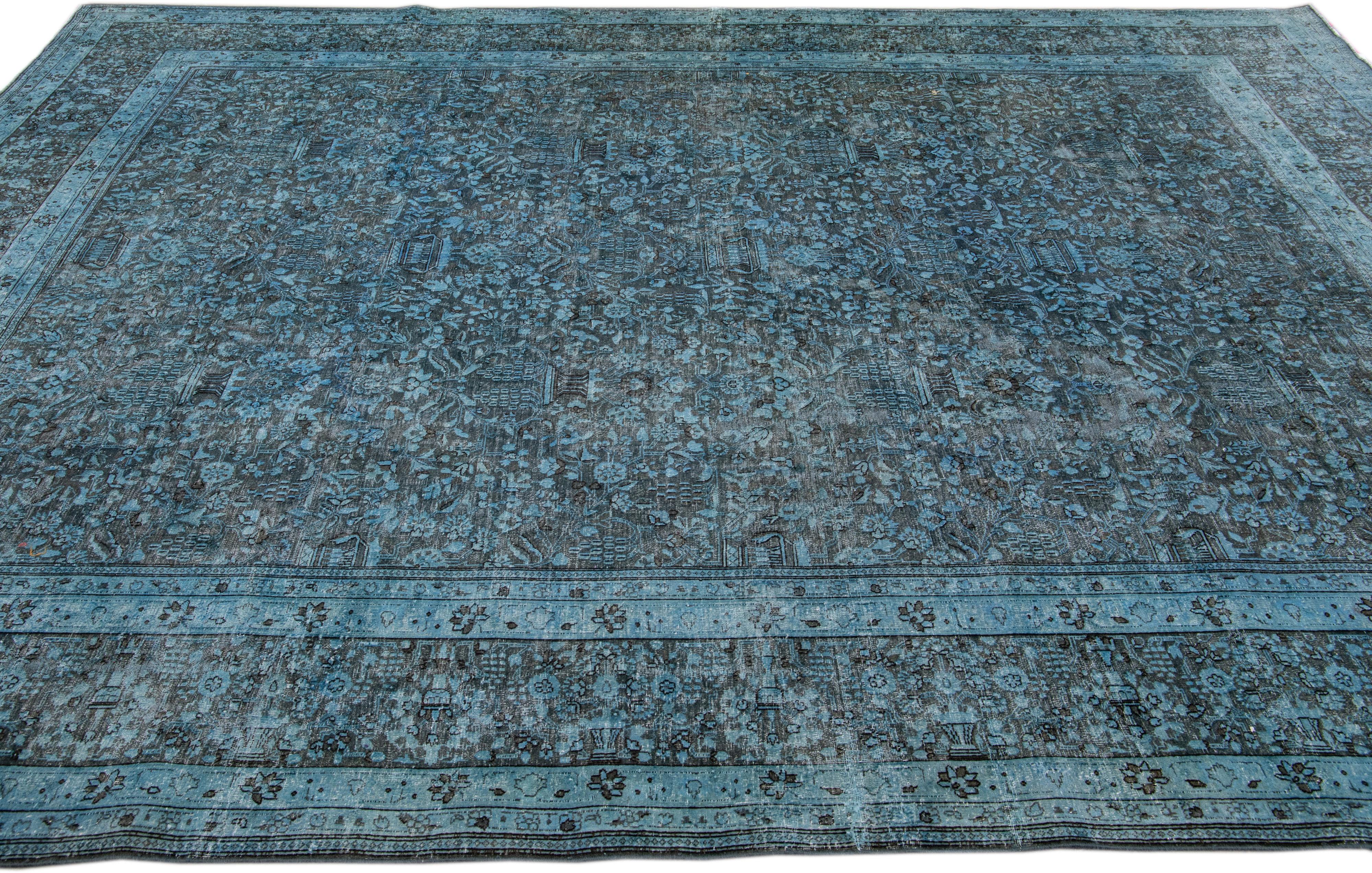 Vintage Persian Overdyed Handmade Floral Blue Wool Rug In Distressed Condition For Sale In Norwalk, CT
