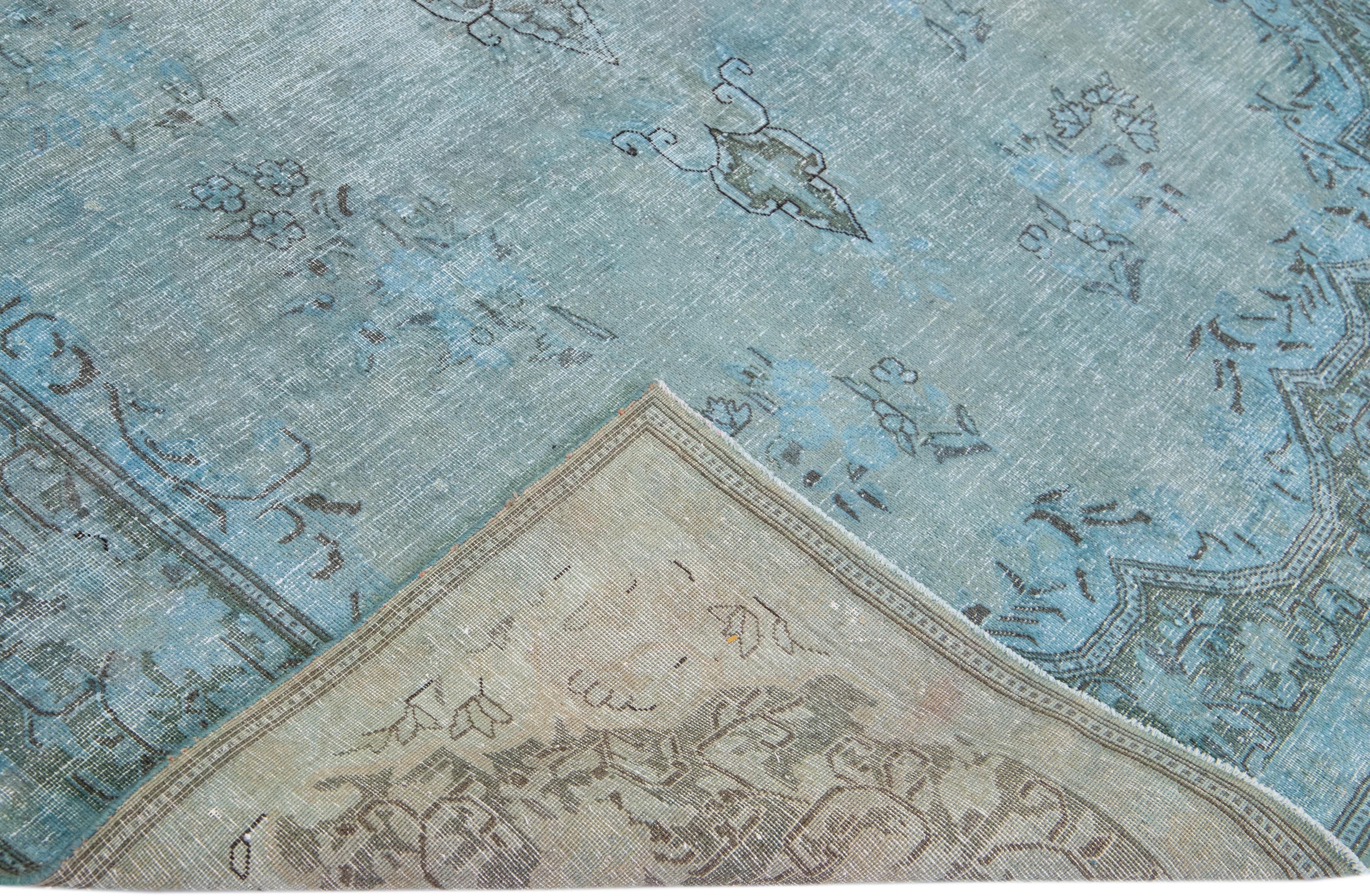 Beautiful Vintage overdyed hand-knotted wool rug with a blue field. This Persian rug has a gray frame in an all-over medallion design.

This rug measures: 8
