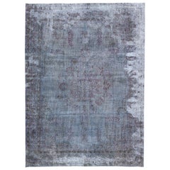 Tappeto vintage persiano sovratinto a mano con medaglione in lana blu
