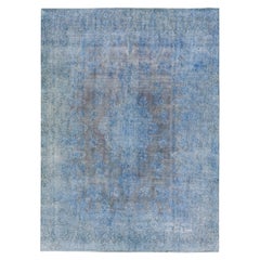 Tappeto vintage persiano sovratinto a mano con medaglione in lana blu