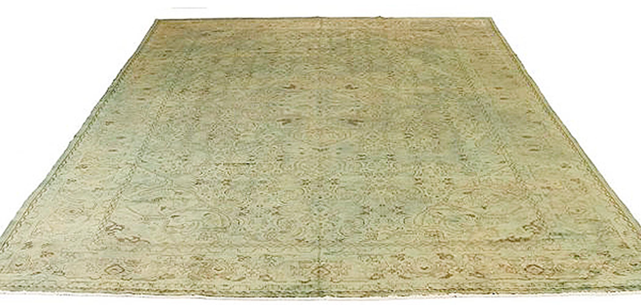 Vintage Persian rug handwoven from the finest sheep’s wool and colored with all-natural vegetable dyes that are safe for humans and pets. It’s an overdyed piece featuring a green and brown traditional motif. It has a dimension of 10’ x 13’2” which