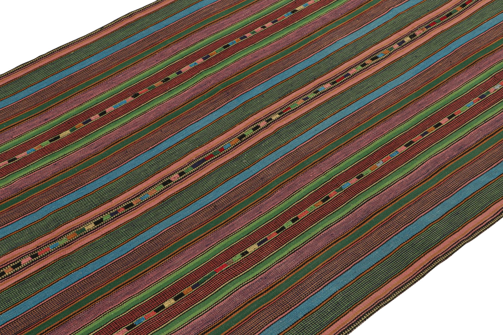 This vintage 6x11 Persian Kilim from Kurdistan employs the distinct “palas” weaving technique. 

On the Design:

Handwoven in wool, the pattern enjoys red, blue & green stripes for a bold sense of movement. Connoisseurs may admire the rustic