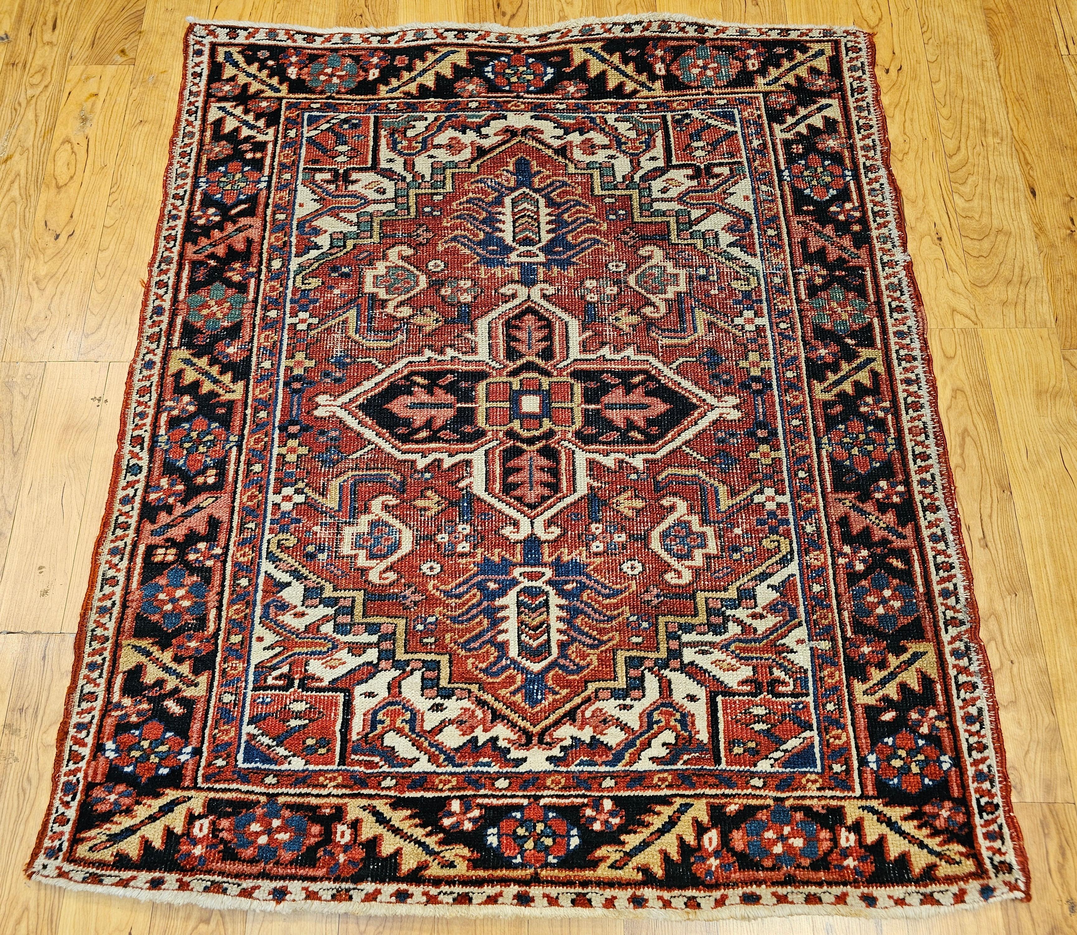 A truly exceptional and rare example of Persian weaving, this hand-knotted Heriz Serapi rug from the first quarter of the 20th century stands out for its uncommon near-square dimensions—a highly sought-after format rarely found in traditional
