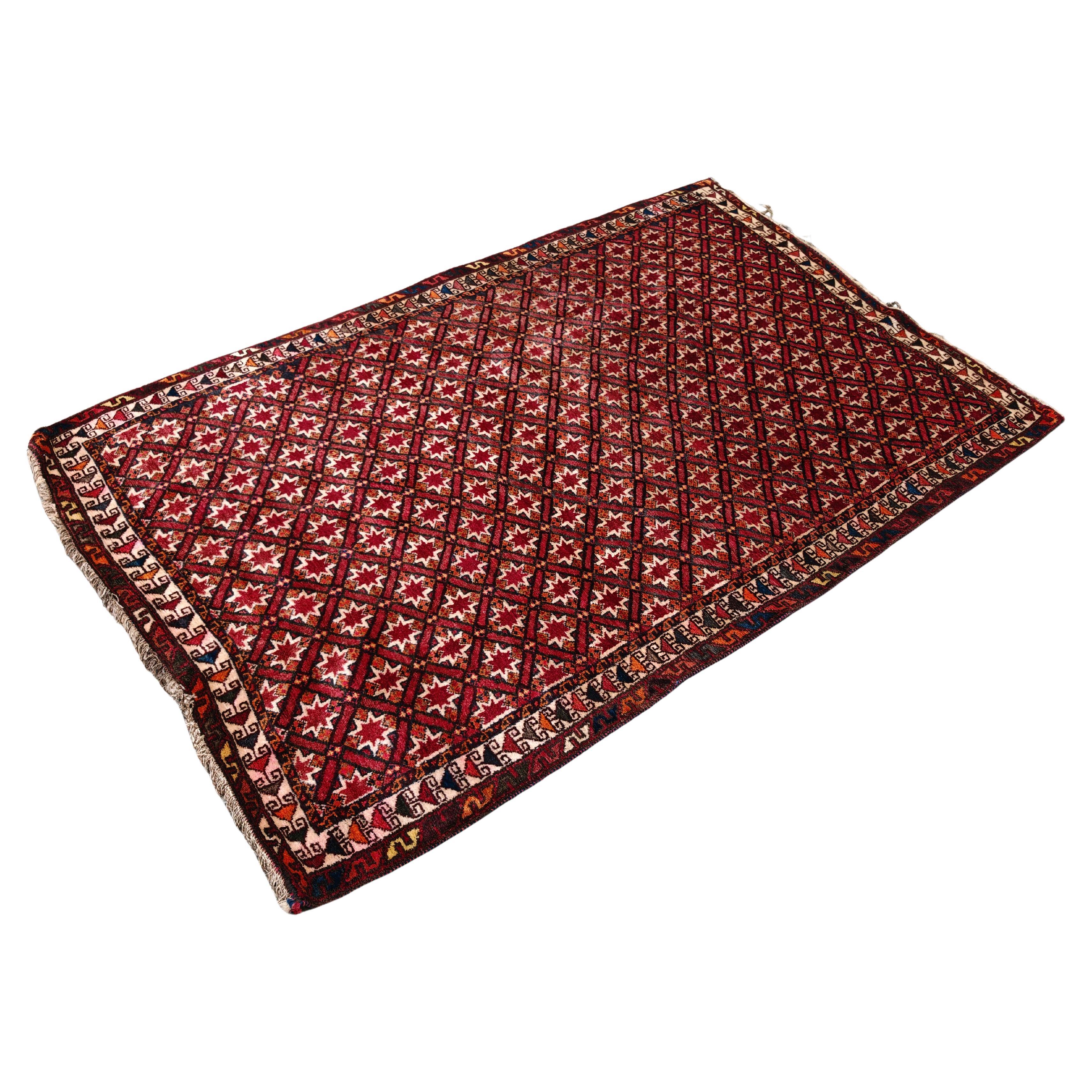 Vintage Persian Qashqai rug, hand-woven in brick red wool in the 1940s