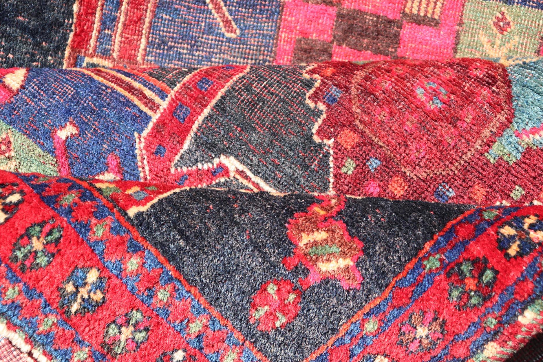 XX secolo Vintage Persian Qashqai Rug with Vibrant Tribal Motifs 4'6 x 9'8 in vendita