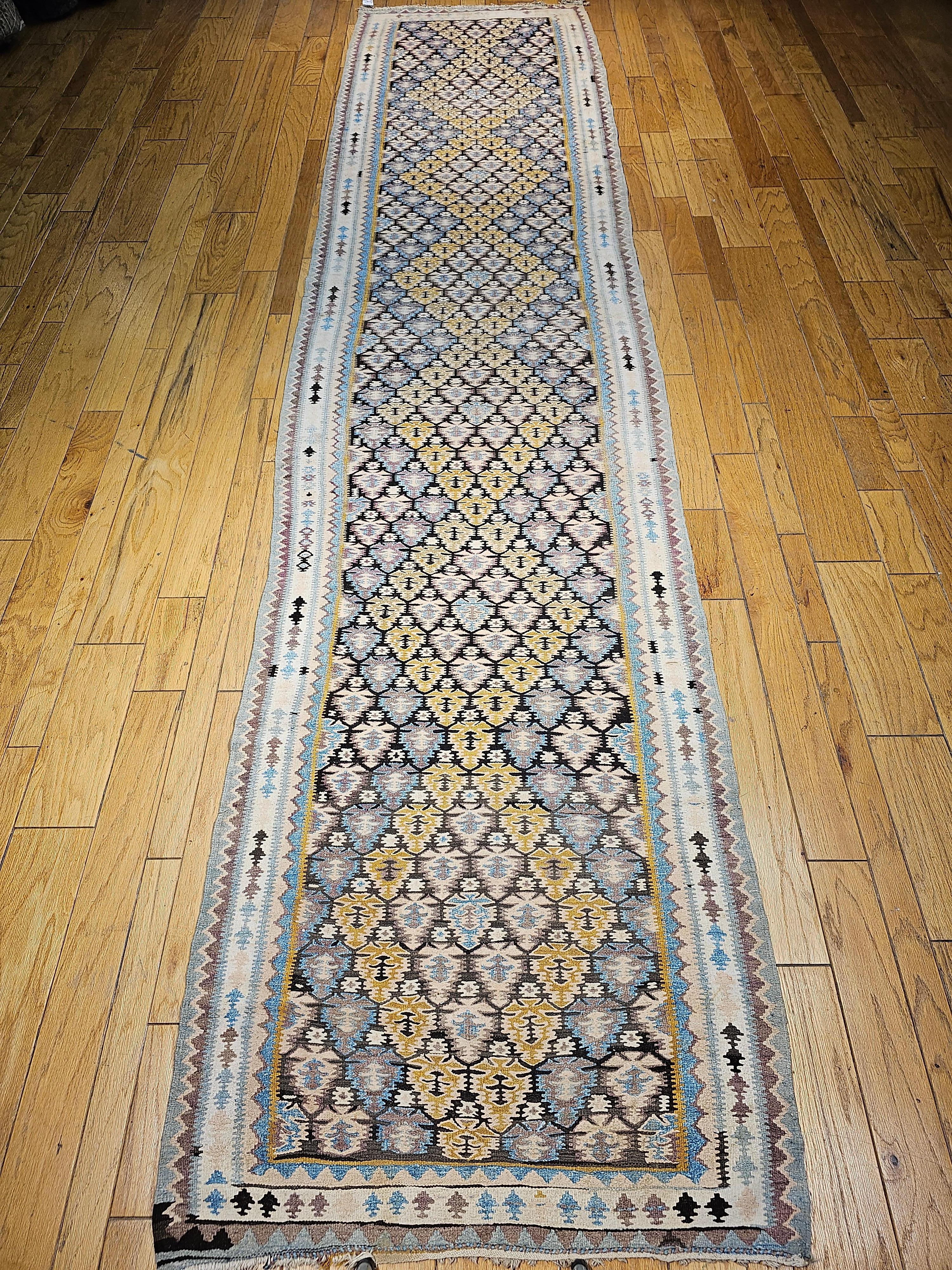 Vintage Persian Kilim (flat woven) long runner has a brilliant geometric design and wonderful colors.   Beautiful Persian kilim runner is from the city of Qazvin in central Persia which was a major stop on the ancient Silk Road.   The allover design