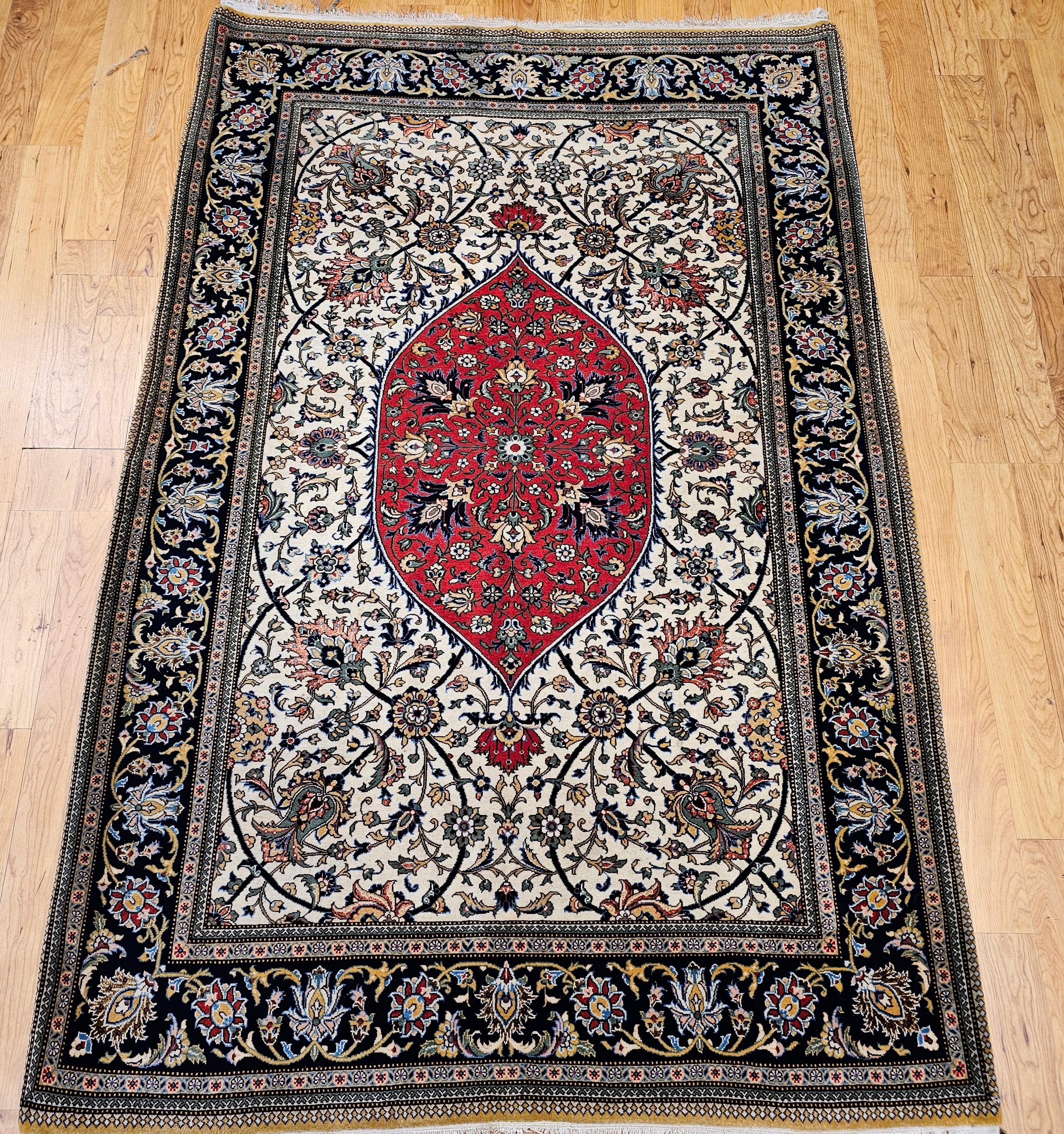 Discover the unparalleled beauty and refined artistry of this Mid-20th Century Vintage Persian Qum Area Rug, meticulously hand-knotted circa the mid-1900s. This exceptional rug is a testament to the supreme craftsmanship for which Qum rugs are