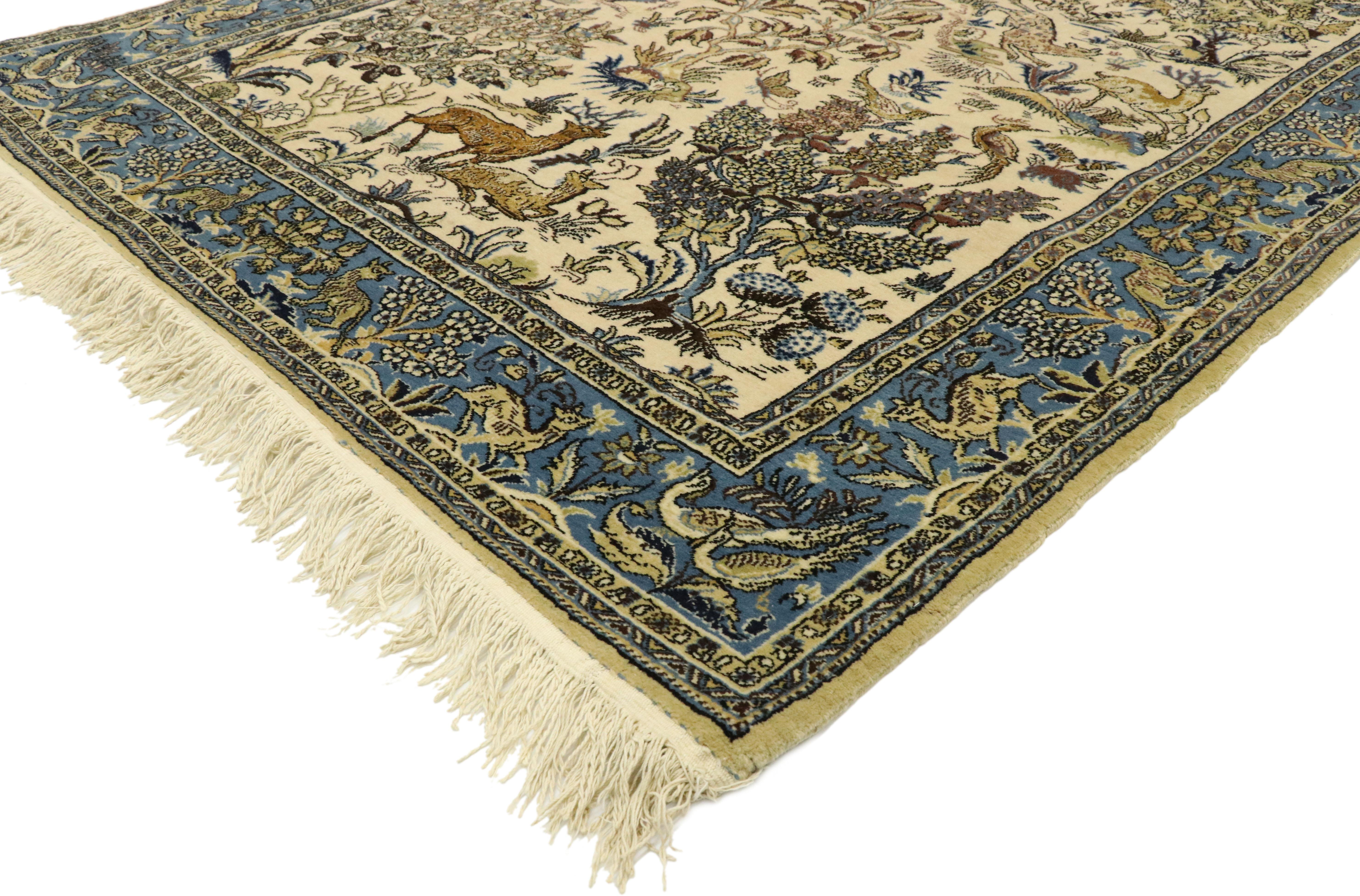 77513 vintage Persian Qum rug with botanical hunting scene 04'06 x 07'00. With it's timeless elegance and regal charm, this hand knotted wool vintage Persian Qum rug features a lively botanical hunting scene of flora and fauna. The beige colored