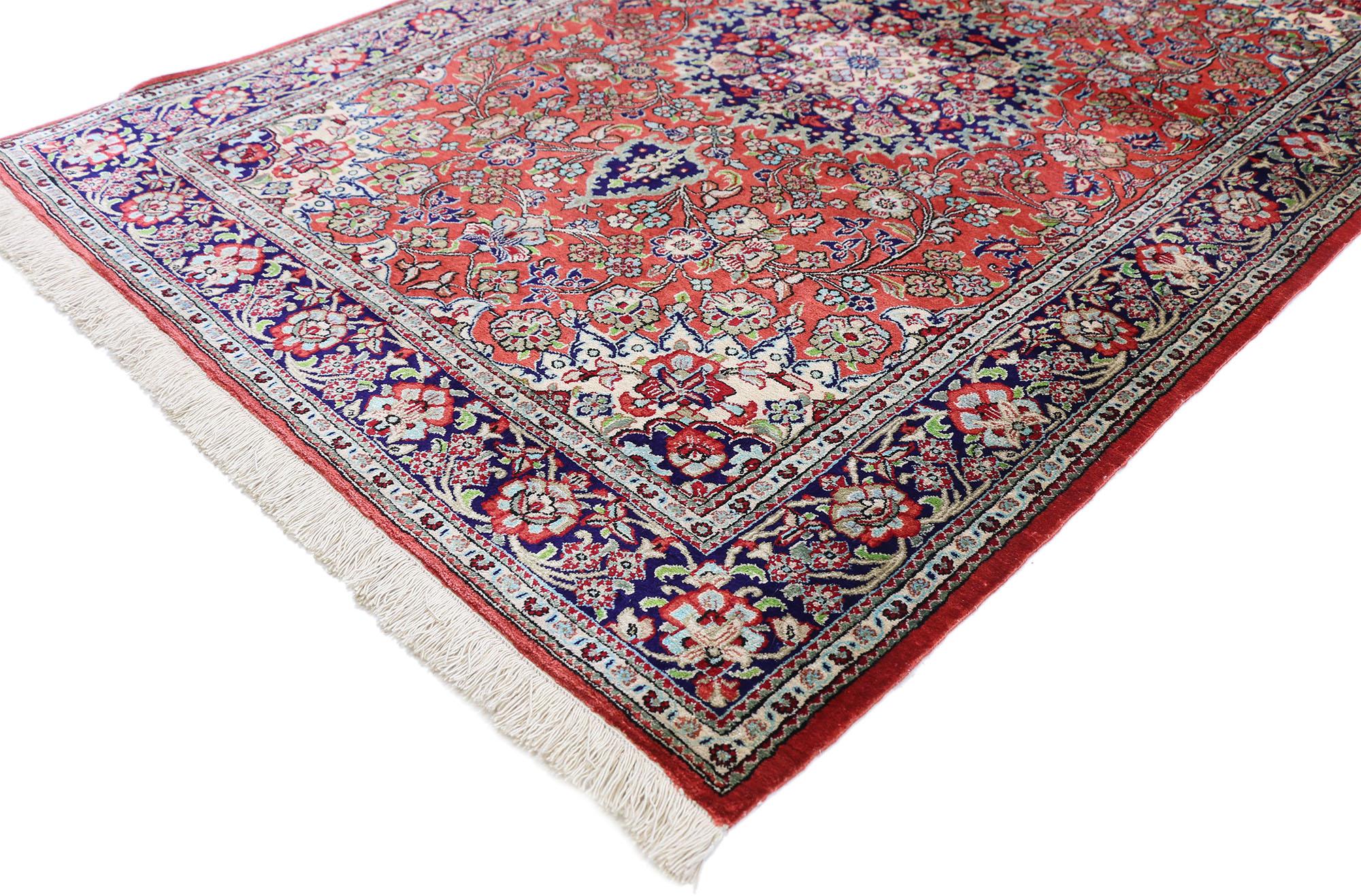 74314, vintage Persian Qum silk rug with traditional style. This vintage Persian Qum silk rug with traditional style features a centre medallion and elaborate spandrels with an all-over pattern surrounded by a classic border creating a well-balanced