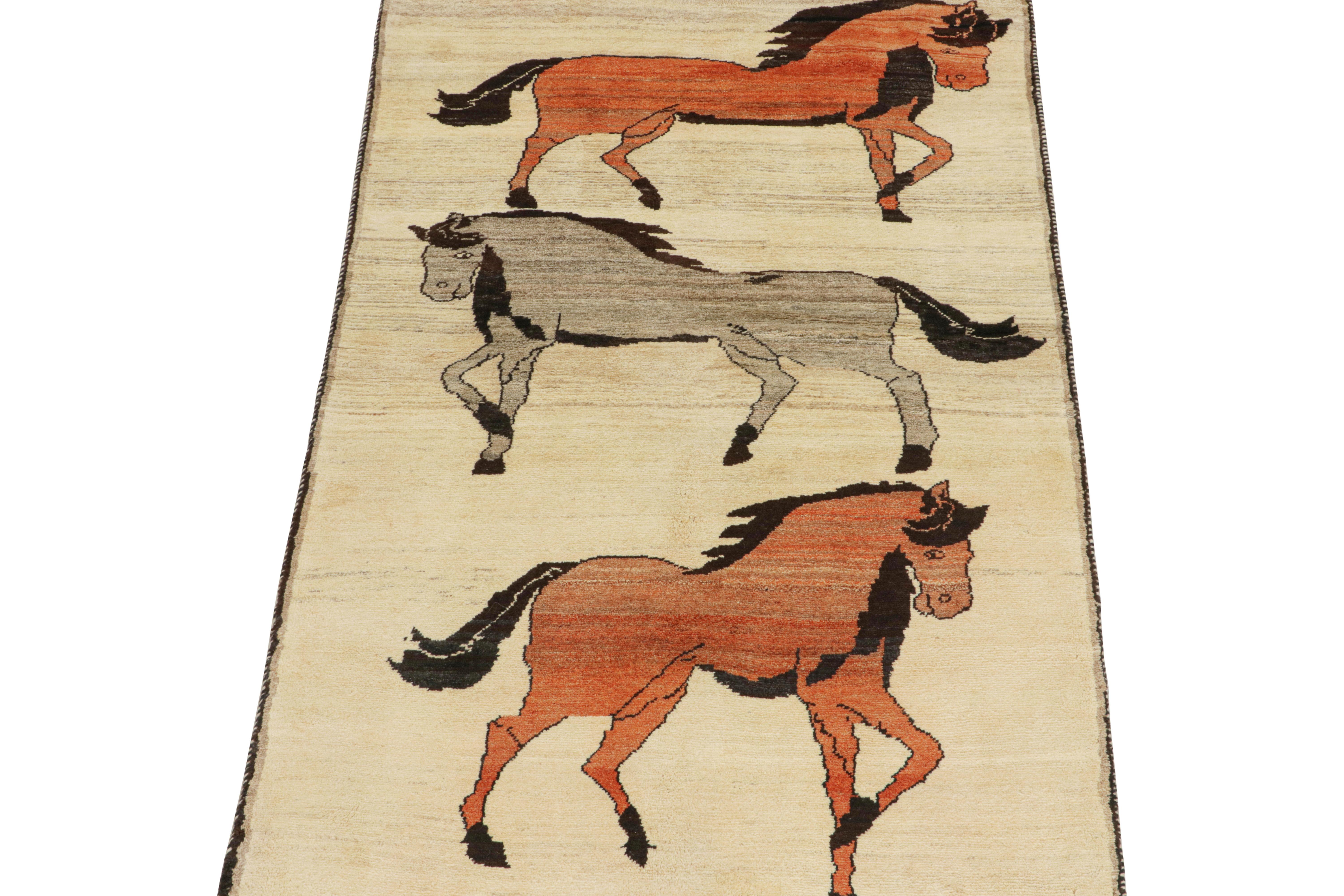 This vintage 4x7 Persian rug is a rare tribal piece, hand-knotted in wool circa 1950-1960.

The design favors a beige field that hosts three horse pictorials in rust and silver-gray with black accents. It’s a collectible piece of primitivist folk