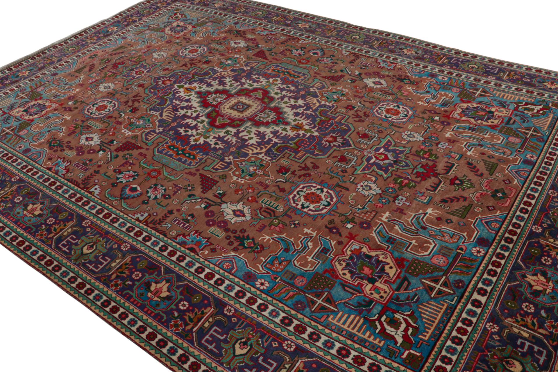 Handknotted in wool, a vintage 10x13 Persian rug originating circa 1970-1980 - latest to enter Rug & Kilim’s assortment of one of a kind vintage pieces.

On the Design:

This handsome piece carries an impressive number of colors. Keen eyes will note