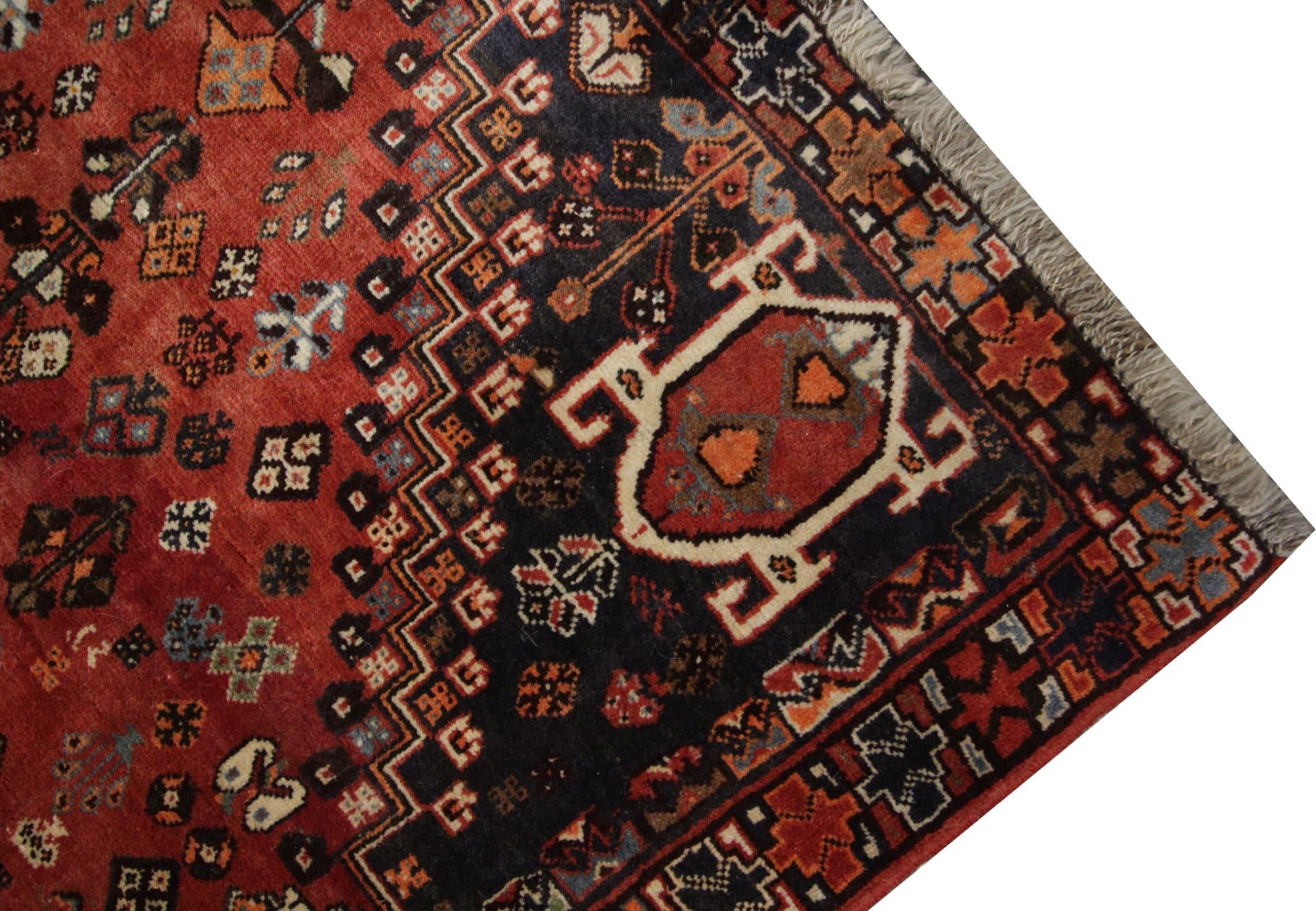Indulge in timeless elegance with our vintage handmade rug carpet, a captivating addition to your living space. Skillfully hand-knotted in the 1970s, this rug boasts an exceptional weave that exudes both charm and durability. Its exquisite tribal