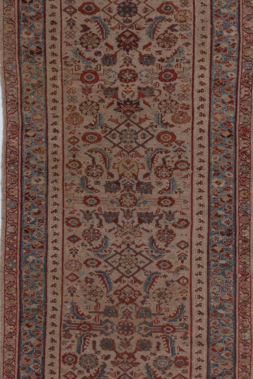 Vintage Persian Runner

Pile: Low worn

Good condition. Beautiful warm camel field with all over herati pattern. Faded soft reds and blue tones. 

Wear notes: none

Wear Guide:
Vintage and antique rugs are by nature, pre-loved and may show