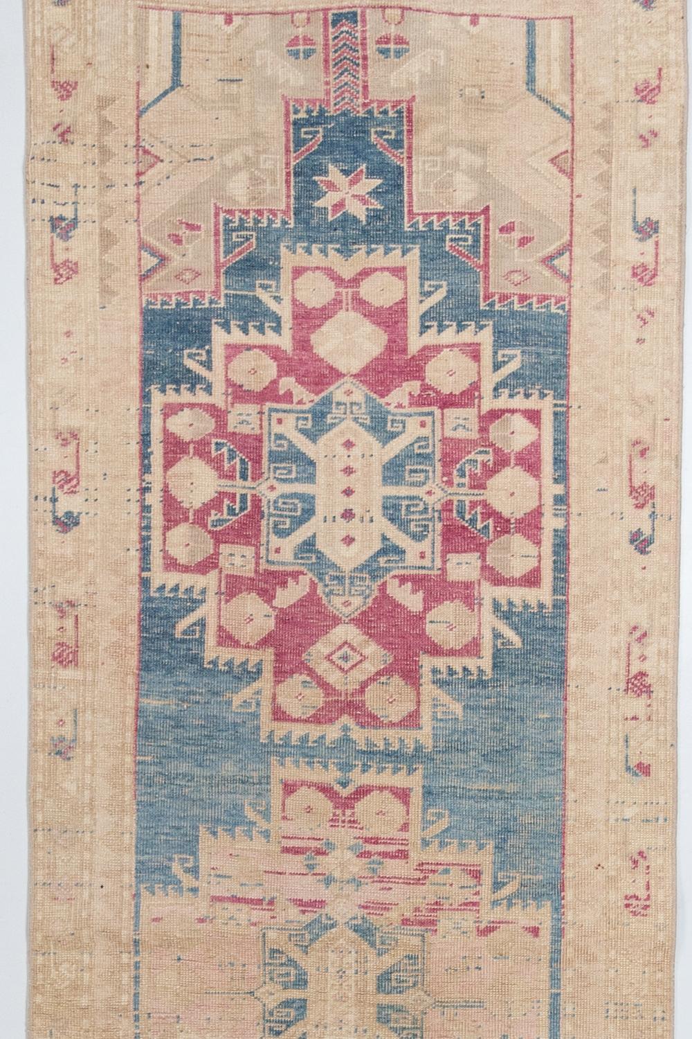 Vintage Persian runner

Circa 1940

Pile: Low

Good condition. Blue field with light pink and magenta accents.

Wear notes: none

Wear Guide:
Vintage and antique rugs are by nature, pre-loved and may show evidence of their past. There are
