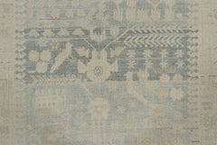 Alfombra persa vintage con motivos florales y animales en tonos beige y azul - Alfombras y kilims