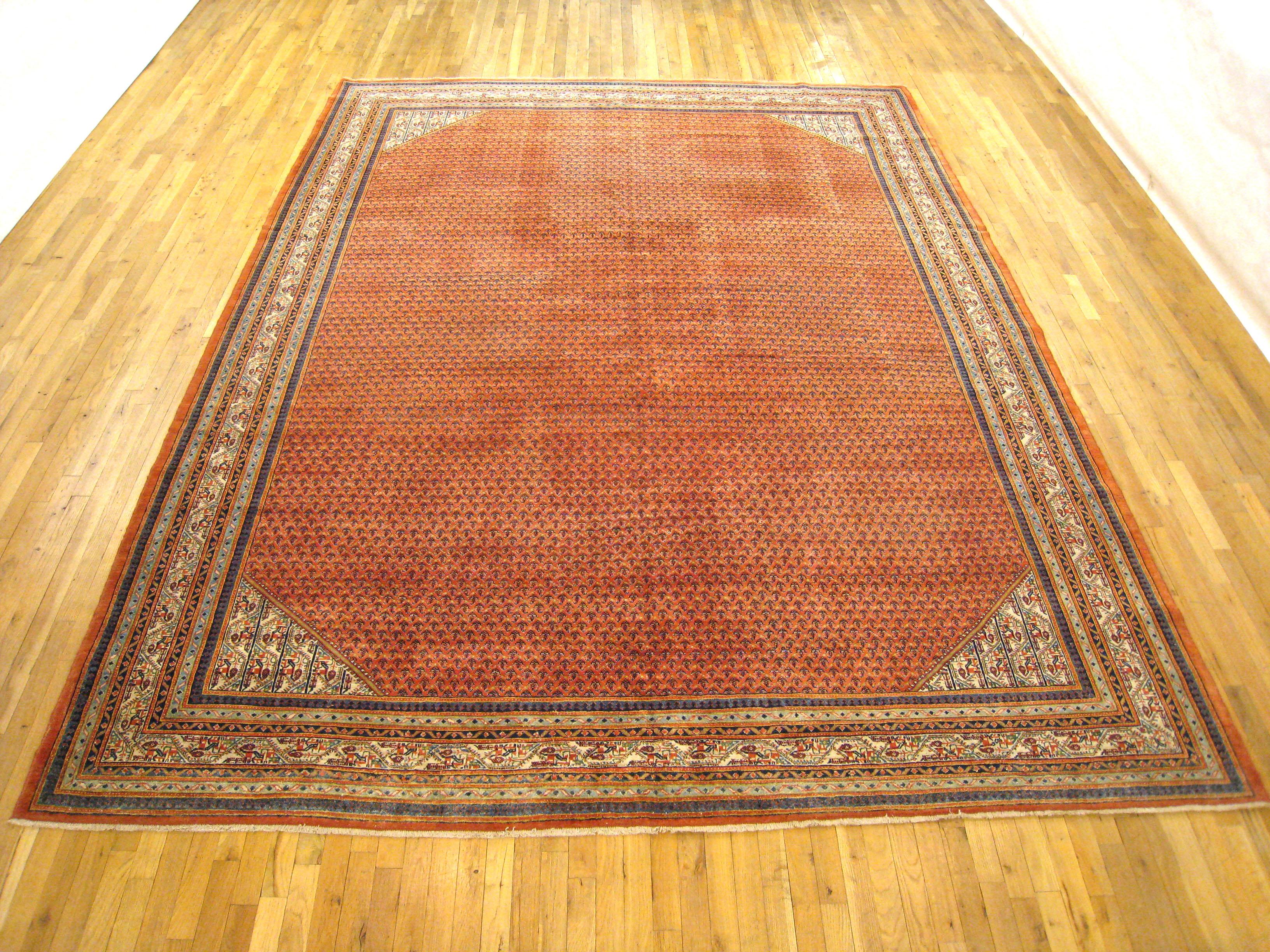 Vintage Persian Saraband Rug, Room size, circa 1940

A one-of-a-kind vintage Persian Saraband Oriental Carpet, hand-knotted with thick and lustrous wool pile. This classic carpet features a Paisley design allover a large soft red field, with an