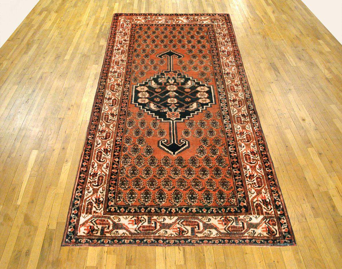 Vintage Persian Saraband rug, small size, circa 1930.

A one-of-a-kind vintage Persian Saraband Oriental Carpet, hand-knotted with thick and lustrous wool pile. This classic carpet features a central medallion with a Paisley design allover a large