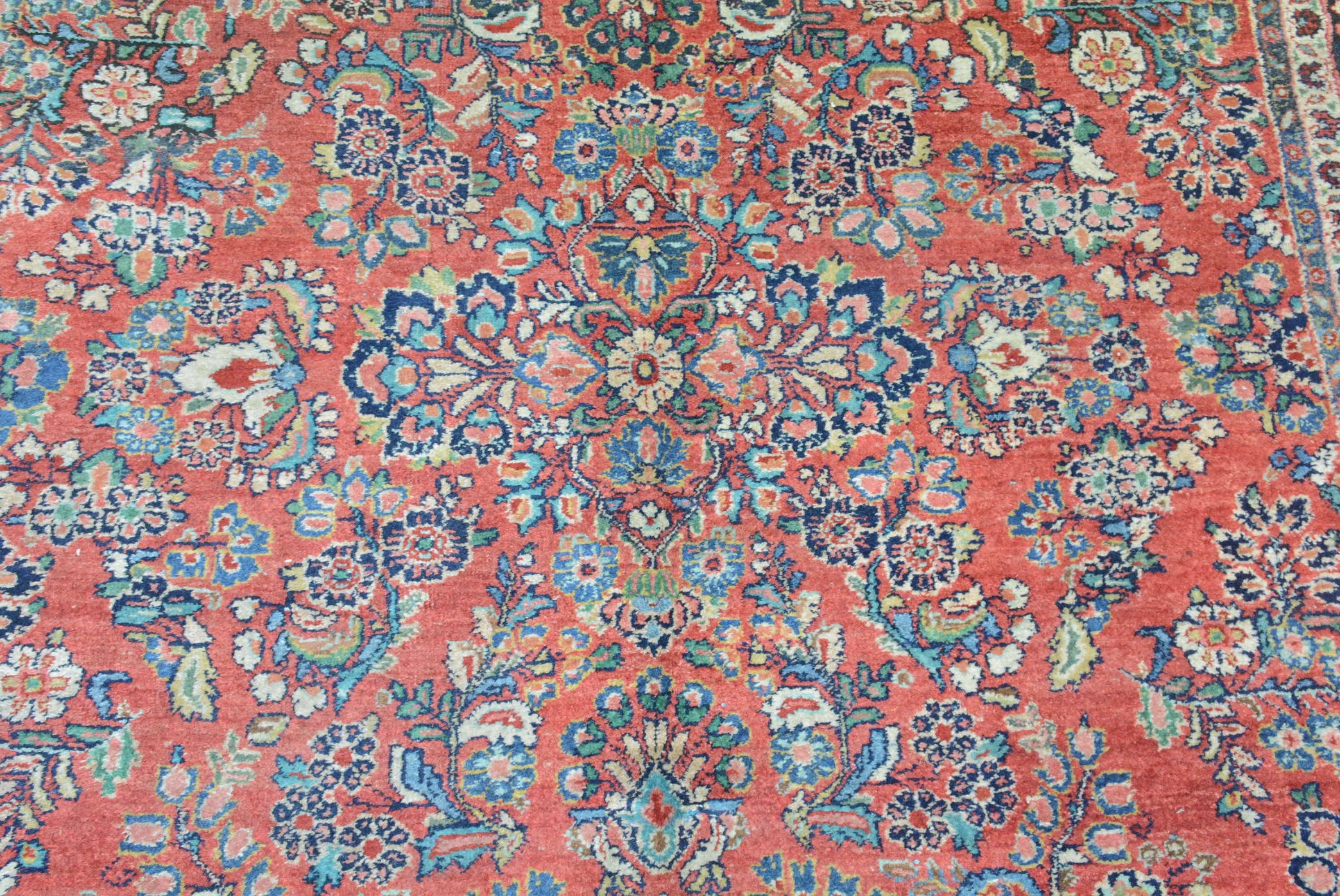 The village of Sarouk in the Arak province in northern Persia is known for producing finely woven rugs and carpets.  These rugs most often have central floral medallions flanked by sprays on either a madder or indigo field.  During the first quarter