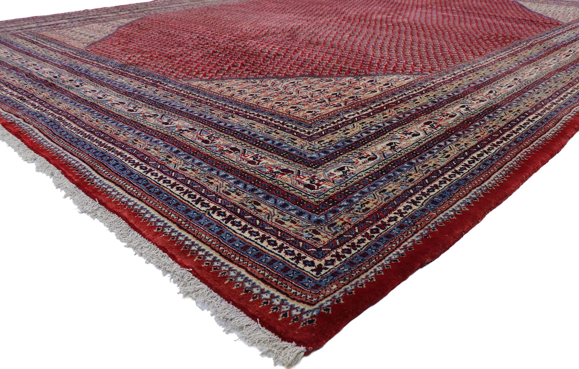78064 Vintage Persian Sarouk Mir Boteh rug with Jacobean Style 11'05 x 15'11. With its striking appeal and saturated red color palette, this hand-knotted wool vintage Persian Sarouk Mir Boteh rug appears like a sumptuous Italian velvet, recalling