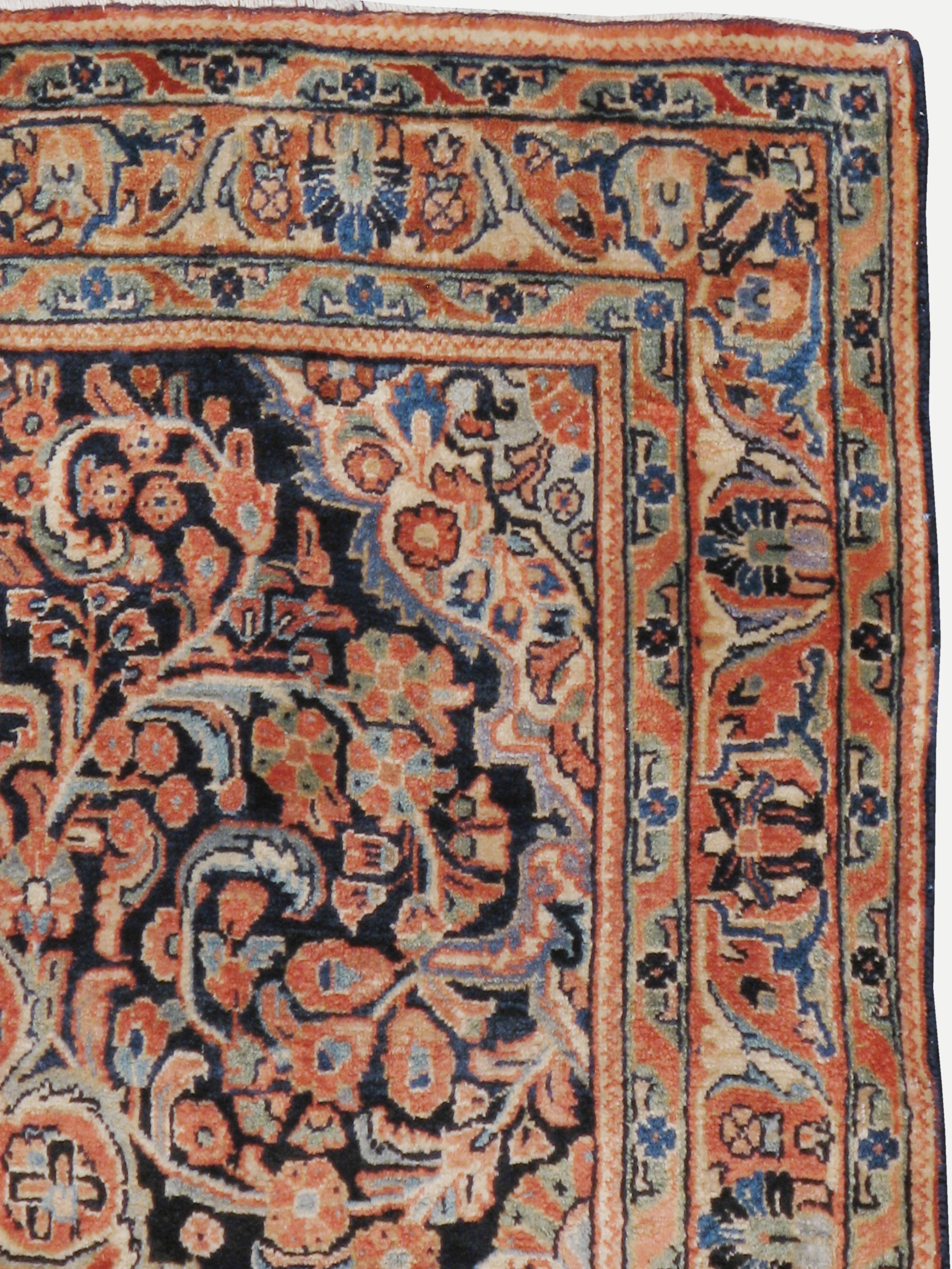 A vintage Persian Sarouk rug from the mid-20th century.